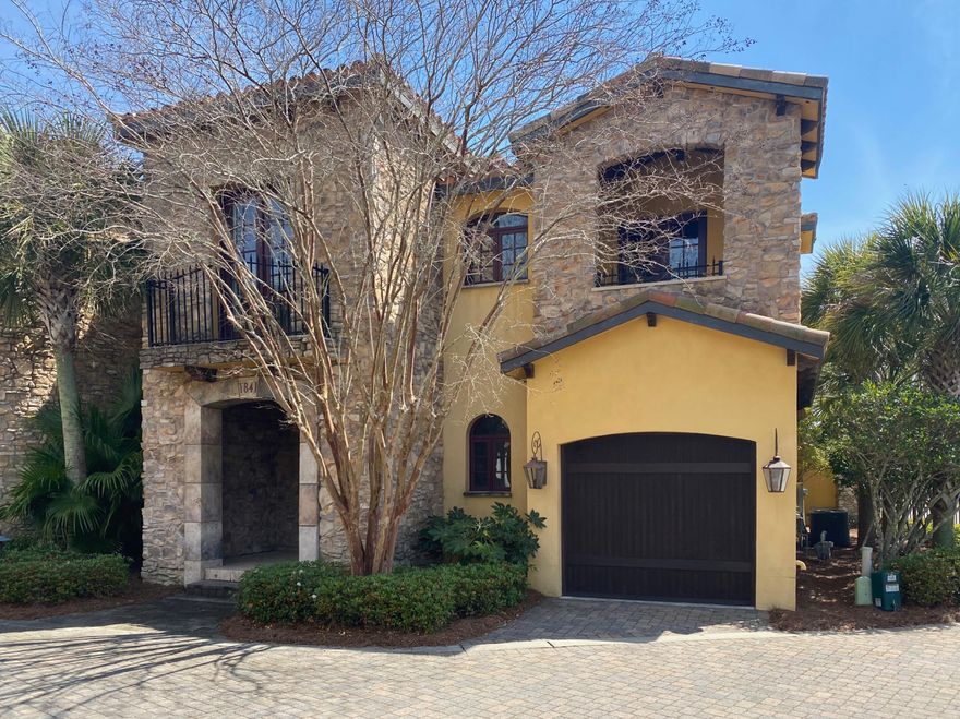 This Tuscan themed townhome offers charming Italian designs on the exterior including tile roofs, turrets, stone work, washed stucco, covered decks and Juliet-style balcony. The interior boasts Viking appliances, granite countertops, stone fireplaces in living area and upstairs master, travertine floors, custom woodwork, exposed rafters and beams. This Resort Community amenities include tennis courts, fitness club access, four pools, and discounts on golf and beach set-ups.
