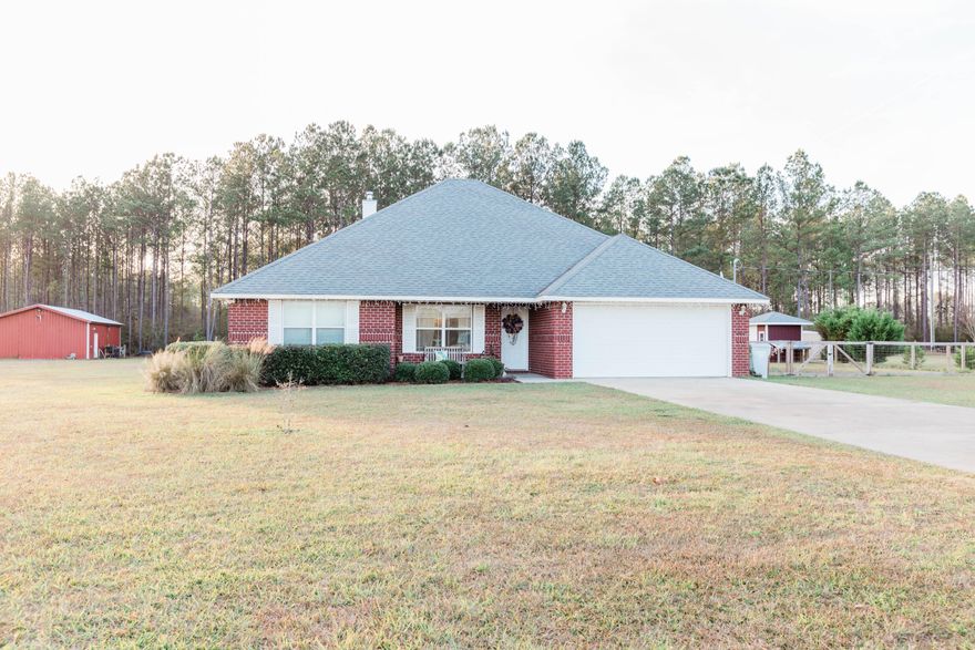 Country living at its best with all the amenities that a city offers within a short drive.  Just six short miles north of 5 Points, this is a beautiful 4 bedroom 2 bathroom house where you can spread out and relax in a wide open setting.  There is a split floor plan with wood and tile throughout the home.  There is an oversized breakfast bar that can seat up to six stools and perfect for entertaining.  The main bedroom has double vanities, a garden tub and separate shower.    Outside is a covered front porch , screened back porch and an extra large driveway with plenty of parking.  Come take a look and see what this beautiful home has to offer.