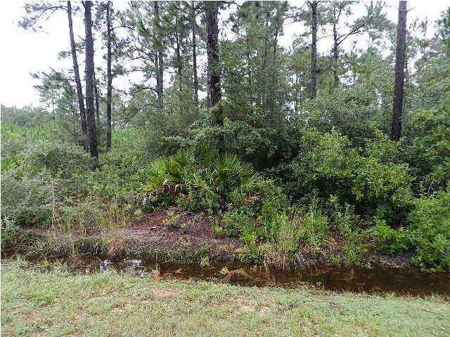 GREAT buildable lot in Holley by the Sea! Public sewer is available, Level, flat, location is great, needs very little buildup for foundation. located in the Holley by the Sea lifestyle community with fitness center, pools, courts, East Bay Boat ramp and close to Hidden Creek 18 Hole Championship Golf Course. Builders welcome.