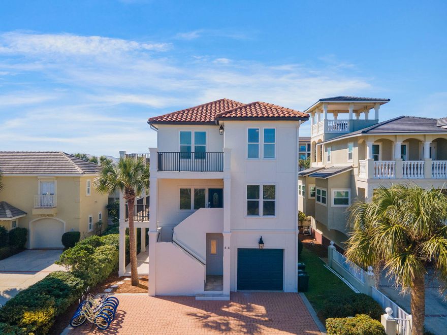 Welcome to Isla del Sol, a breathtaking 7-bedroom, 6-bathroom coastal escape nestled in the heart of Scenic 30A's Blue Mountain Beach community. This stunning three-story home accommodates up to 16 guests and offers unparalleled Emerald Coast views from expansive upper-floor balconies. With a prime location just a short walk from the beach and access to a community pool, Isla del Sol is the perfect destination for a memorable getaway.Step inside to discover seamless indoor-outdoor living. The first floor features a spacious bunk room with two twin-over-full beds and direct access to a beautiful outdoor patio. Fire up the propane grill for alfresco dining beneath swaying palm trees, and take advantage of the laundry room with a full-sized refrigerator for added convenience. The main level of Isla del Sol is designed for gathering, with a bright and airy great room adorned with coastal-inspired d??cor, white-washed wood accents, and sea-blue hues. The gourmet kitchen boasts sleek black granite countertops, stylish blue cabinetry, and matching black appliances, creating a perfect blend of elegance and charm. A large dining table seats 12 guests, while the kitchen island doubles as a breakfast bar for 4ideal for morning coffee or casual snacks. Relax in the spacious living area with plush seating and a TV, or step onto the private balcony to enjoy breathtaking sunrises and sunsets. This floor also includes a guest bedroom, perfect for added privacy.

Upstairs, the top floor offers ultimate comfort and serenity with three beautifully appointed bedrooms. The primary suite features a private balcony, while two guest bedrooms share an expansive balcony with cozy seatingthe perfect spot to unwind and soak in the coastal breeze.

With on-site parking for 4 vehicles and 7 adult bikes included, guests can easily explore the nearby Timpoochee Trail and Point Washington State Forest. Whether you're looking to relax by the Gulf, bike scenic coastal paths, or simply enjoy time with loved ones, Isla del Sol delivers the perfect mix of comfort and luxury.