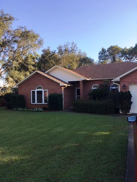 FANTASTIC 4 bedroom home for sale in Navarre, FL. You'll love this WATERFRONT neighborhood. This all brick home is located on a quiet cul de sac close to shopping, military bases and beautiful Navarre Beach! This home has been lovingly cared for, well maintained and updated. You will appreciate the remodeled kitchen and master bathroom with an incredible spa shower, along with new windows, garage door, extra insulation, Cat 6 internet, Trex deck, roof with secondary water barrier..... There are so many features you NEED to CHECK out the ''Documents'' tab to read more. You will also LOVE this backyard. Open the double back door and enjoy the peace and quiet on the 18'x 12' deck.Special financing incentives available on this property from SIRVA Mortgage. Call before it's too lat