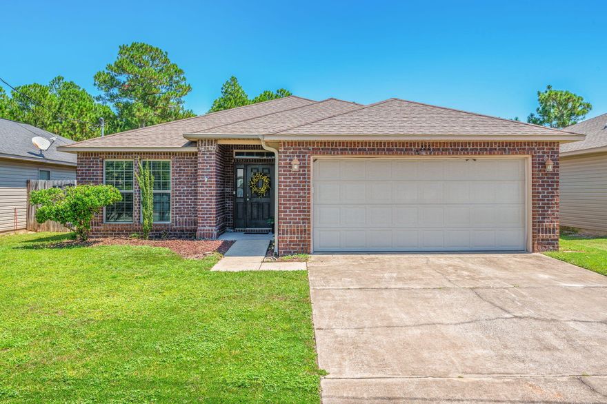 Charming 3-Bedroom Home on Spacious Lot Near Hurlburt Field & Navarre AttractionsWelcome to this well-maintained 3-bedroom, 2-bathroom home ideally located just minutes from Hurlburt Field, Navarre Beach, and all the shopping, dining, and entertainment Navarre has to offer. Tucked away on a generously sized lot, this home offers both comfort and convenience in one of the area's most desirable locations. Inside, you'll find a smart split-bedroom floor plan featuring a spacious master suite with a luxurious en-suite bathroom, complete with a garden tub for relaxing at the end of the day. Two additional bedrooms are located at the front of the home, providing privacy and flexibility for guests, family, or a home office. The kitchen is a chef's delight with granite countertops, stainless steel appliances, and an open design that flows seamlessly into the large great room and dining areaperfect for entertaining or everyday living. Enjoy views of the backyard right from your kitchen or dining space.  Step outside and discover a backyard with potentialthe fenced area is just the beginning. The property extends well beyond the fence, offering space for gardening, play, or even future expansion.

Located just around the corner from Navarre High School and only a 10-minute drive to the white sands of Navarre Beach, this home is truly a must-see. Whether you're a military family, first-time buyer, or looking for a peaceful place near it all, this home has it all.
Don't miss your chanceschedule a private tour today!

UPDATES:
HVAC- 2024
Hot water Heater- 2024
Oven/ Stove- 2023
Dishwasher- 2022
Vent caps - 2022
Garage Door Opener- 2023
* entire home was recently pressured washed*
Washer & dryer remain with home. 