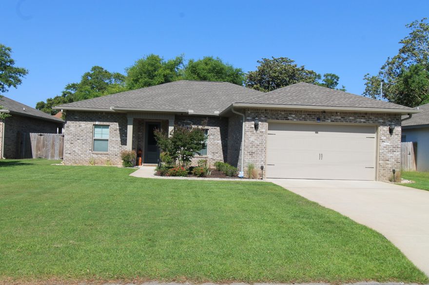 Awesome new plan! This 4/3 custom brick home has super curb appeal and is constructed on a deep lot with both large front and rear yards. There are 10 Ft. Ceilings w/ impressive crown molding, has LVP flooring throughout most of the home except for the wet areas which are tiled. At the right of the dining room  is the gourmet kitchen which boasts bisque cabinetry, granite countertops, a breakfast bar and stainless appliances. Bedrooms 1 and 2 are located near the front entry along with bathrooms 1 and 2. The large master suite is located at the rear of the home and  has a double vanity, 2 large walk -in closets, whirlpool tub and separate shower. Yard is fully sodded/ landscaped and comes complete with a well and sprinkler system. Completion expected in early March 2023.