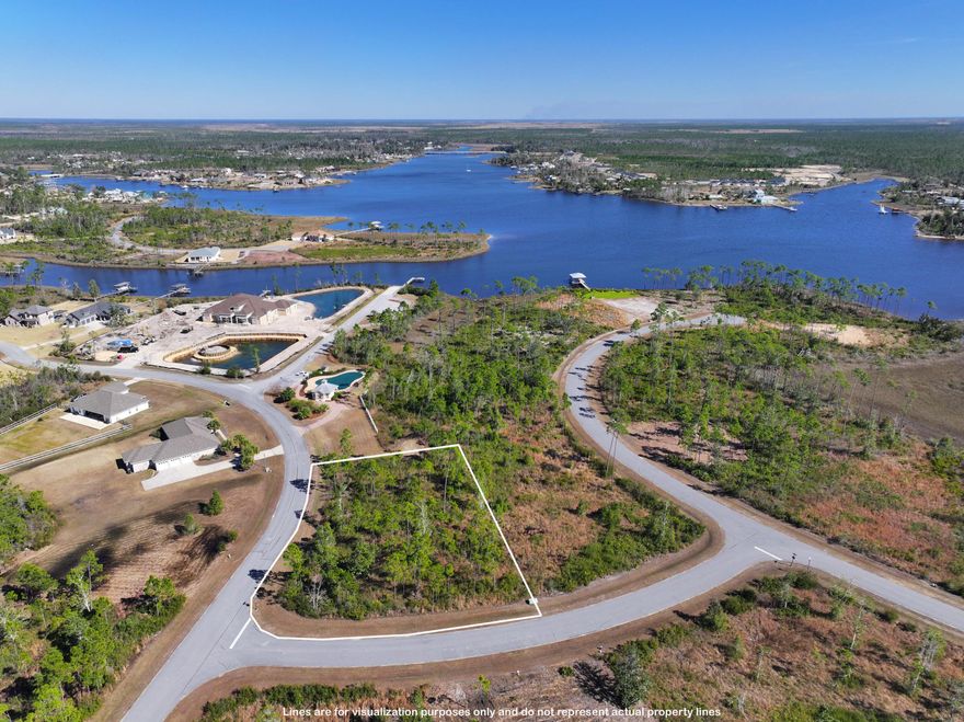 This large corner lot is located in the serene and scenic gated community of Laird Bayou. Amenities include community pool & pool house, community boat dock with ramp/launch, a gated boat and RV storage area, and a waterfront pavilion/gazebo. Residents are rewarded with an irresistible combination of the natural beauty that Laird Bayou Is known for and the nearby convenience of the Panama City beaches, restaurants and attractions. Approximately a 15 minute drive to Tyndall AFB.