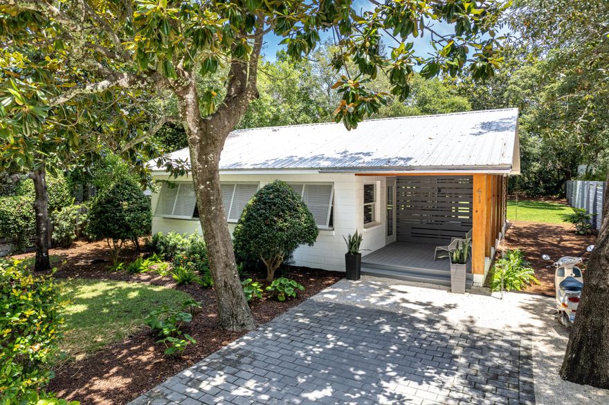 Just  feet from exclusive county beach access, 41 E Grove offers effortless entry to one of the area's most pristine and expansive stretches of county owned public beach and  just a moment away from this charming 2-bedroom beach cottage . The property  presents a rare opportunity to embrace Old Seagrove in an unmatched setting nestled among mature trees. Ideally located near Seaside, WaterColor, shopping and top-rated restaurants, it's also perfect for biking around 30A's scenic bike paths. Fully remodeled mid century modern in 2016 with an open kitchen, quartz tops, library book shelving and on demand hot water.