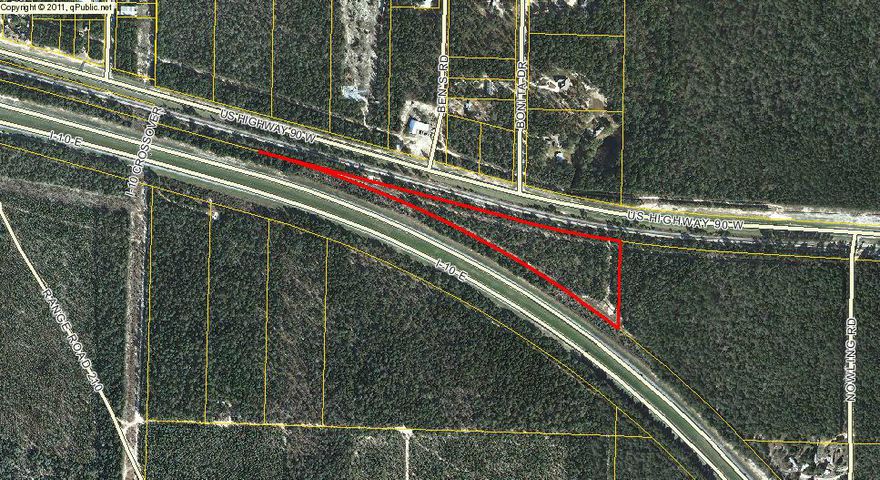 Approximately 6.5 wooded acres lying on Hwy 90. Electricity and water nearby. Buyer is responsible to verify zoning,schools, utilities, dimensions and other matters of importance.