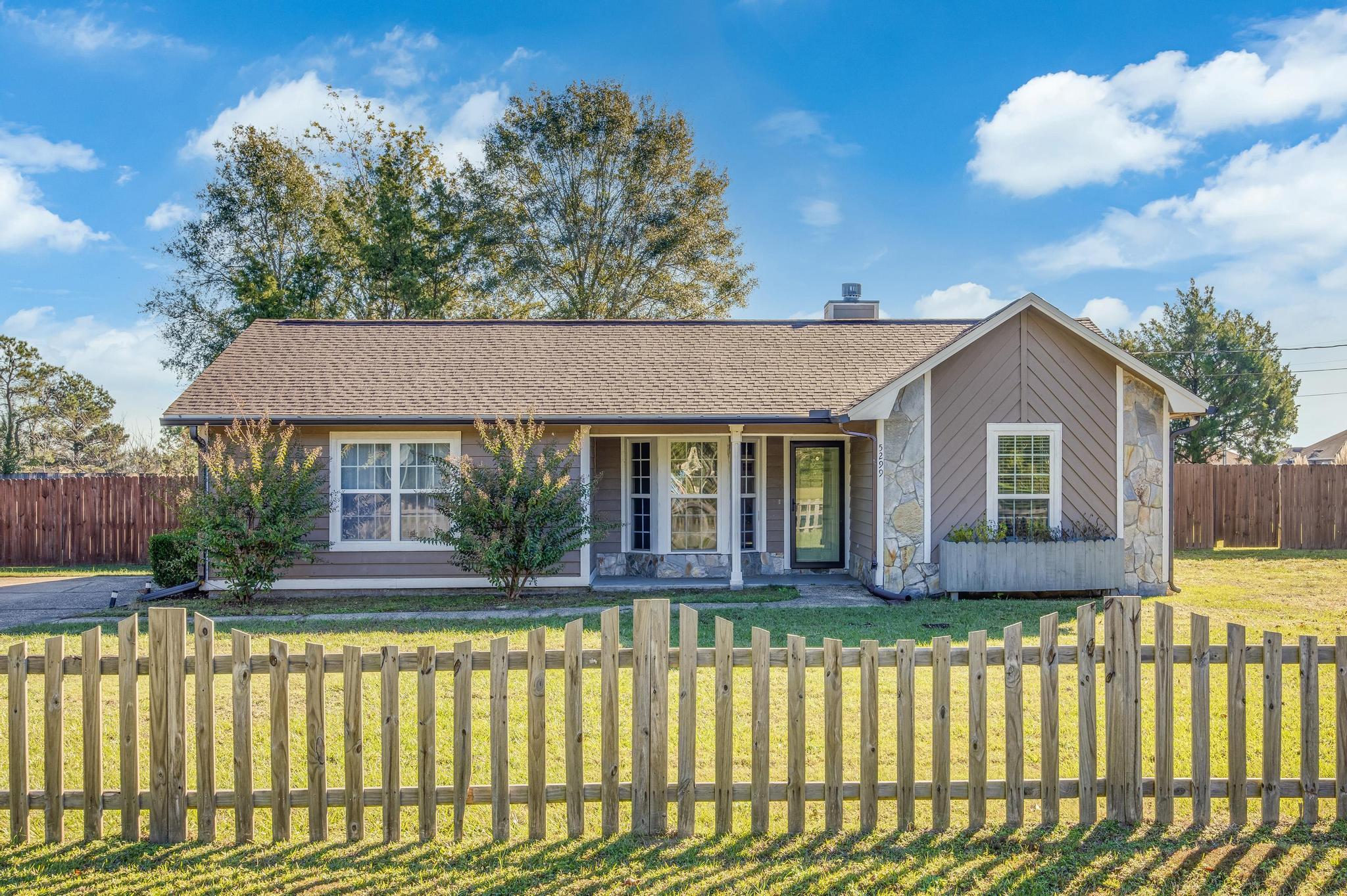 This wonderful 3 bedroom 2 bathroom home sits on just over an acre of fenced in property in the heart of Baker! The home has been very well maintained and it definitely shows!! The back yard of the home has a detached one car garage with an extra heated/cooled storage space or possibly a man cave or she shed! Ceramic wood plank tiles through out the home, new roof in 2021. There are two pantries in the kitchen for optimum storage! Stone faced gas fire place in the living area, huge Florida room right out of the back door of the living room area and much more!!! Come make this beautiful home your own!!!!