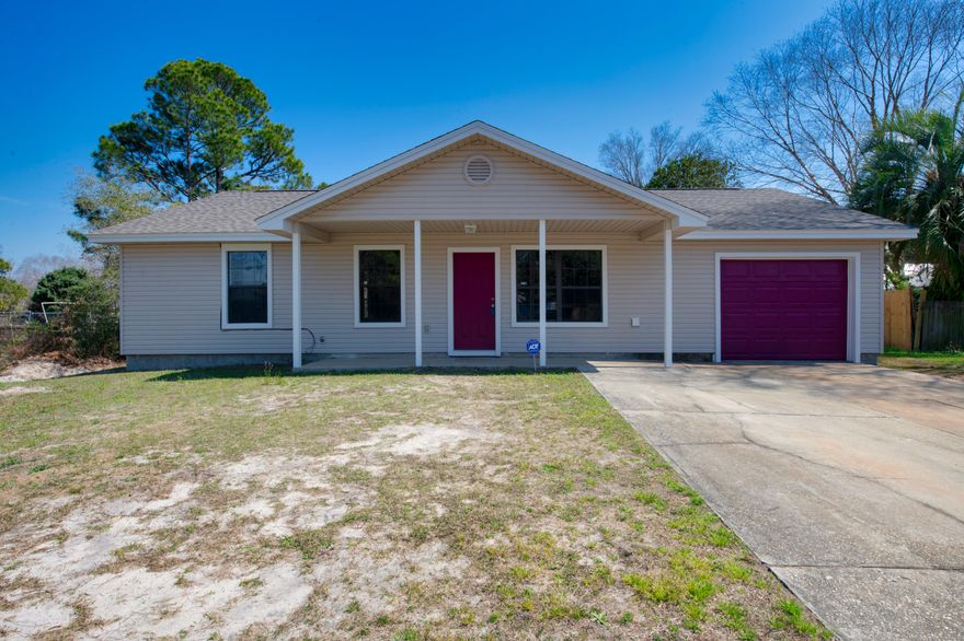 Located 3 miles from the beautiful beaches of Navarre, this home is NEWLY RENOVATED!! This home is situated near beaches and shopping. This spacious almost half acre lot is partially fenced in (with 2 of the 3 sides of the fencing being new) and has an extra driveway pad attached to original. The interior is COMPLETELY renovated with brand new vinyl plank flooring throughout most of the house (tile in the kitchen and Master Bath), NEW bathroom vanity in guest bathroom, NEW roof in 2021, NEW HVAC, NEW hot water heater in 2021, NEW fixtures, NEW interior and exterior doors, NEWLY PAINTED, NEW automatic garage door opener, NEW ceiling fans, NEW textured walls and ceilings and NEW baseboards. The kitchen has all black appliances and has an attached laundry area. Make this your home today!!