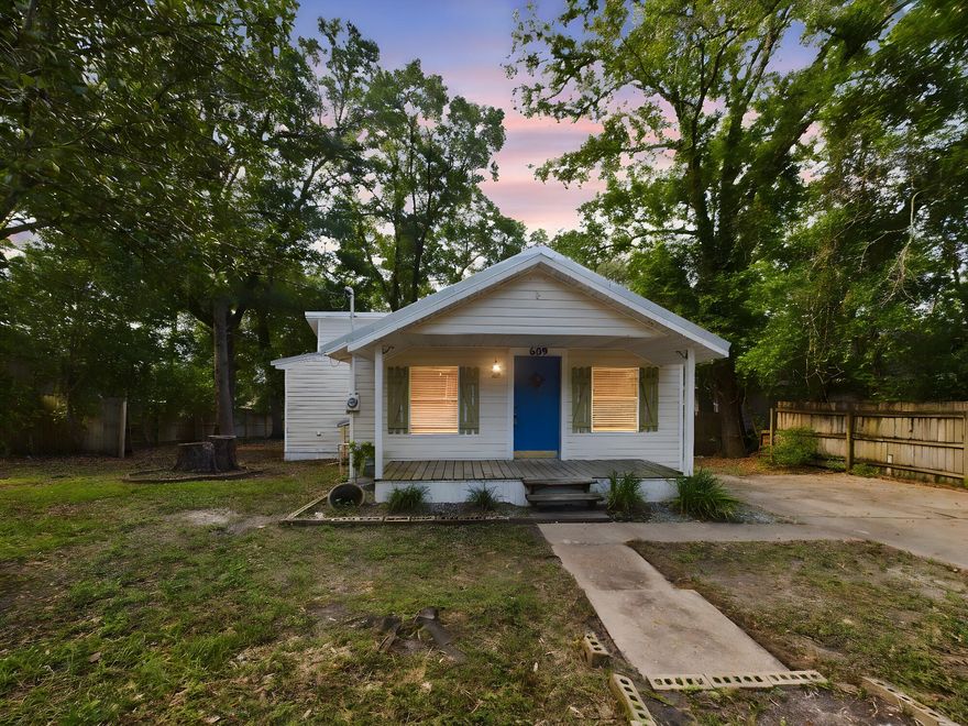 BACK ON MARKET at no fault of the seller. Buyer walked day before closing.This cottage offers an incredible investment opportunity, centrally located and just two blocks from the water, offering easy access to beautiful waterfront views and activities. It's also within walking distance to local restaurants, shopping, parks, and schools.  Seller believes the roof and HVAC to be 10 years old and the HWH to be 7 years old.  The interior features custom woodwork throughout, with wood floors, walls, and ceilings that exude warmth and character. The ceilings, though at the lowest legal height of 7 feet, add to the cozy, intimate feel of the home. The home includes a welcoming family room, a quaint eat-in kitchen with a gas stove/oven, dishwasher, and refrigerator. The kitchen countertops are beautifully tiled, and the window over the sink providesThe kitchen countertops are beautifully tiled, and the window over the sink provides a delightful view while you cook. The property boasts a charming front porch perfect for rocking chairs and a back deck ideal for enjoying summer evenings. The large shaded lot is adorned with flowers and vines, adding to the cottage's allure. A matching shed with a metal roof provides ample storage space for lawn equipment or could be transformed into a workshop. This home is an excellent starter home for a small family or an affordable rental option for roommates. Its unique charm and prime location make it a standout choice for an investment. Don't miss the chance to own this cute and cozy cottage that offers so much potential. 