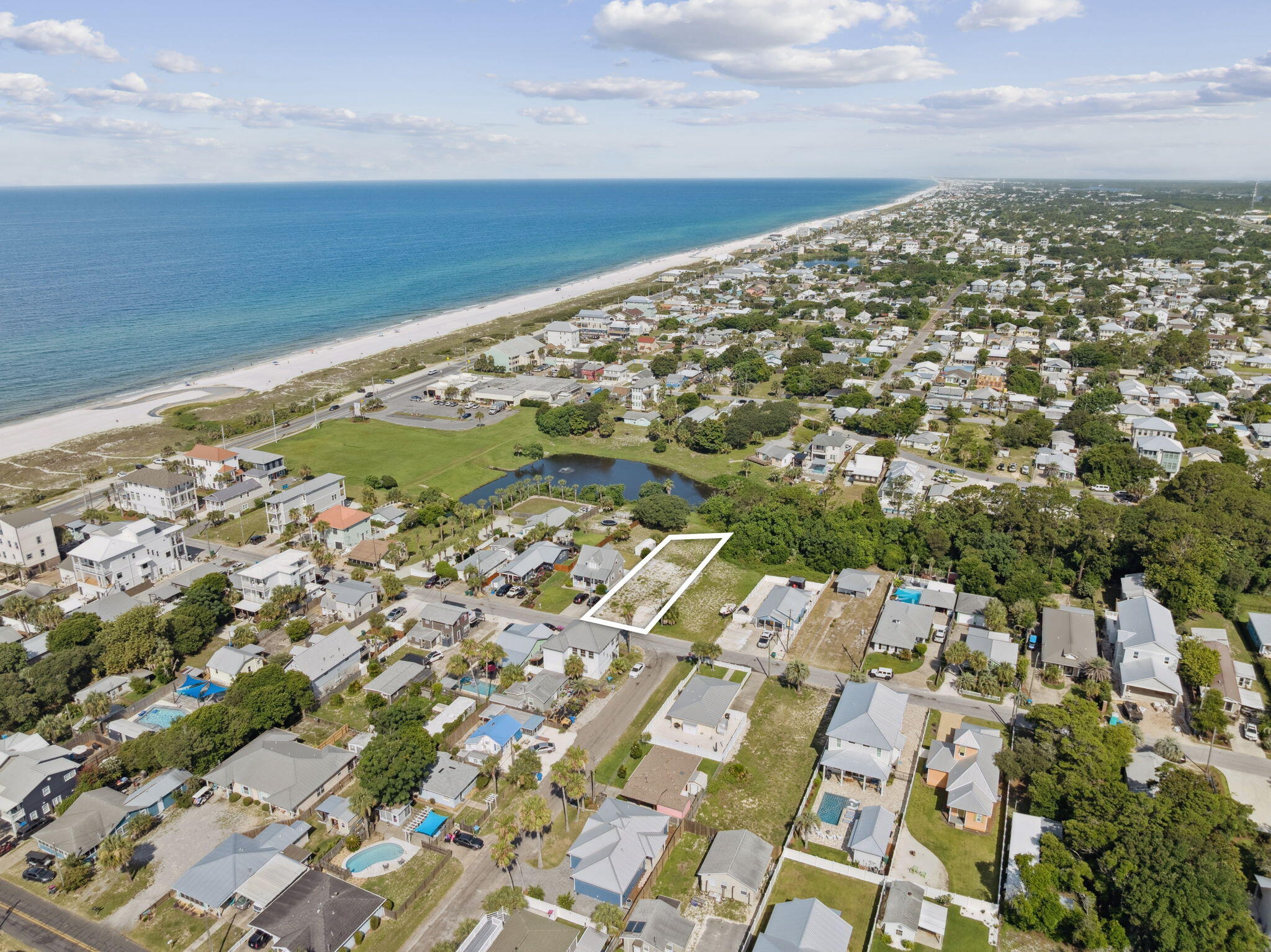 Rare oversized lot just one block from the beach in the heart of Laguna Beach.This exceptional homesite offers a unique opportunity to build your dream coastal retreat or create a multi-home investment in one of Panama City Beach's most beloved neighborhoods. Located just steps from a dedicated beach access, the lot boasts ample space to accommodate a spacious legacy home with Gulf views, or can be subdivided to maximize its development potential. With its generous dimensions and ideal elevation, the property is perfectly suited for a custom-designed residence that captures the beauty of the Emerald Coast. Imagine relaxing on a rooftop deck with panoramic Gulf views, or enjoying breezy afternoons in a backyard built for entertaining--all just moments from the sugar-white sands. The neighborhood is home to a mix of charming beach cottages and newly built multi-million dollar homes, underscoring the long-term value and desirability of this location. Tucked into the peaceful, golf-cart-friendly community of Laguna Beach, you'll enjoy a relaxed, Old Florida atmosphere with no HOA restrictions and a true neighborhood feel. Just a short drive away is the vibrant town center of Pier Park, offering shopping, dining, and entertainment, while the world-class beaches, restaurants, and boutiques of Scenic 30A are also within easy reach. Whether you're looking to build a full-time residence, vacation getaway, or explore a smart development play, this rare lot offers endless potential in a rapidly appreciating, Gulf-side setting.