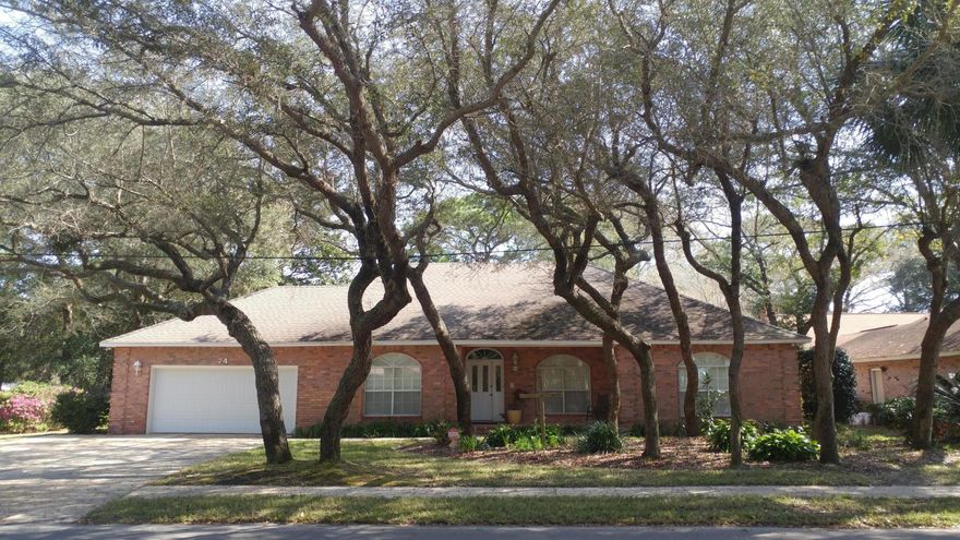 Custom built single story Shalimar home. On a beautiful street of old oak trees. Custom features abound . Nine foot ceilings throughout the entire house . Crown molding throughout . Plantation shutters in the living room, dining room , breakfast room , and sun porch . Driveway with extra lane. True hardwood floors in the entry foyer and kitchen and breakfast room. Granite countertops in the kitchen and three baths . Three bedroom three bath with office/study that could serve as fourth bedroom.Custom cabinets in the office, den, and laundry room. Den has cultured marble fireplace. Master bedroom has large ensuite bath , large walkin closet, extra large shower, Jacuzzi tub , and laundry room with utility tub. Resessed lighting under kitchen cabinets .And much more ! Buyers to verify