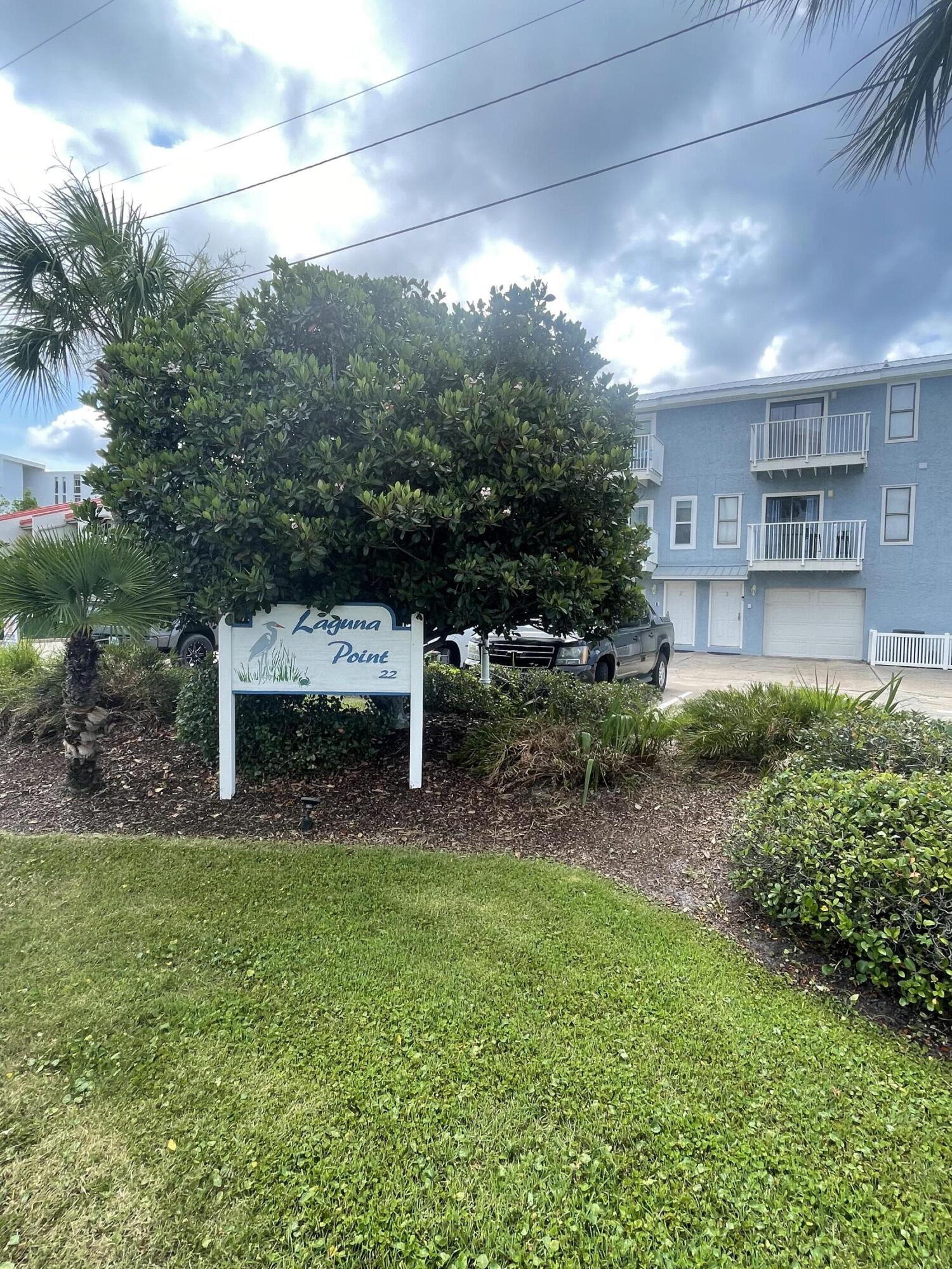 PRICE IMPROVEMENT! Below $500K, this gem is located in the heart of Holiday Isle, conveniently just a short walk, bike or golf cart ride away from private deeded beach access, as well as having a waterfront dock and boat slip access directly on the harbor. 1st floor offers oversized single car garage, with room for golf cart, bikes and vehicle to fit, with storage space to spare! 2nd floor opens to Kitchen, dining area with balcony, half bathroom, and living room with additional balcony. 3rd story hosts two bedrooms with very large closets and en-suite bathrooms. Both bedrooms also have individual private balconies. All the best Harbor activities are an easy water taxi ride away! Primary, Secondary or Rental residence compatible! This unit will come furnished for an easy rental!