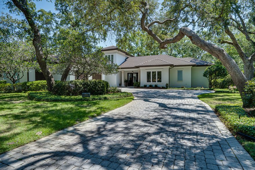 Tucked away among majestic Bay Oak trees, in a park like setting located in The Preserve at Burnt Pine in the Resort of Sandestin, sits a beautiful custom built Huff home. The open floor plan offers three bedrooms, each with an en-suite bath, plus an office, half bath,a sitting/multi-purpose room, large laundry room, many walk-in closets, over sized 2 car garage plus golf cart garage, and comes fully furnished including the custom window treatments, it's perfect. Travertine flooring runs throughout the main floor, and the second level has newly finished hardwood flooring. Just added are many fabulous and stylish chandeliers. The kitchen includes white cabinetry, with gold tone pulls, granite counters, top of the line stainless steel appliances with a Viking induction stove top.