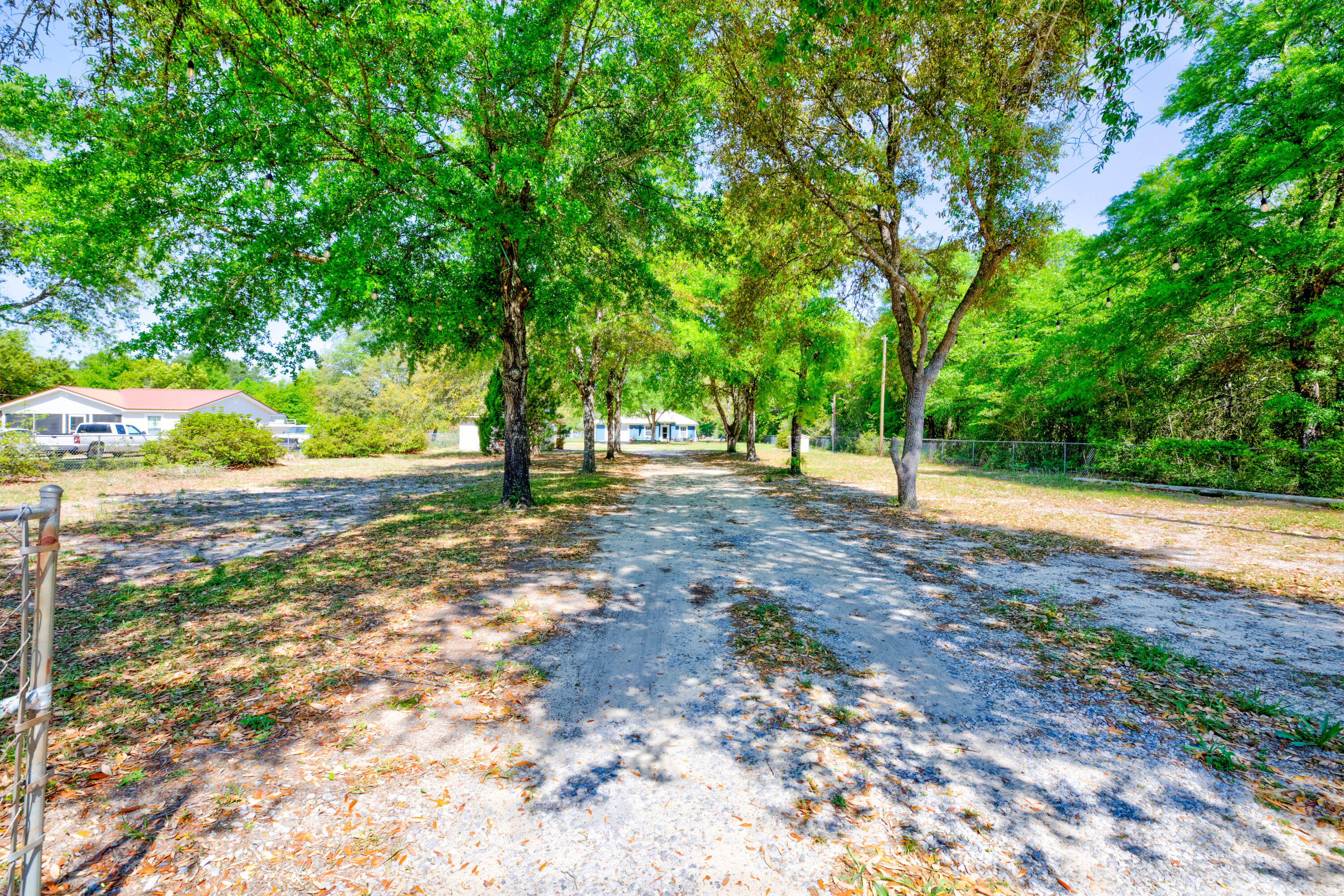 Welcome to this beautifully updated 3 bedroom, 2 bathroom home with an attached garage. This large home-site is fully fenced with an electronic gate. Enjoy the peaceful charm of country living with the convenience of nearby amenities. The property features a greenhouse, climate-controlled storage, and plenty of space to spread out. Updates include fresh exterior paint, sleek countertops, and stainless steel appliances. The primary bathroom offers a walk-in shower and a classic clawfoot tub--ideal for unwinding. This move-in ready home offers comfort, style, and room to grow. Schedule your showing today.