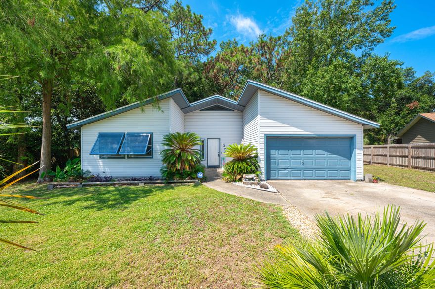 A charming coastal home in the heart of Fort Walton Beach -- beautifully maintained & centrally-located with updates that elevate the character. Located between Eglin AFB & Hurlburt AFB, this 3BD, 2BA home features fresh paint, LVP flooring, large vaulted ceiling living space with fireplace, and a spacious Florida room with view of a private, huge wooded backyard. Bahama shutters add street appeal & privacy for the front bedroom. Master bedroom is located at the back of the house with full, on-suite bathroom and sliding door accessibility to raised back porch. Brand new roof at the end of 2020 and a new HVAC system in 2021 means low maintenance and low future over head costs for the new owner! Properties in this desirable neighborhood move quick -- don't wait to make this place home!