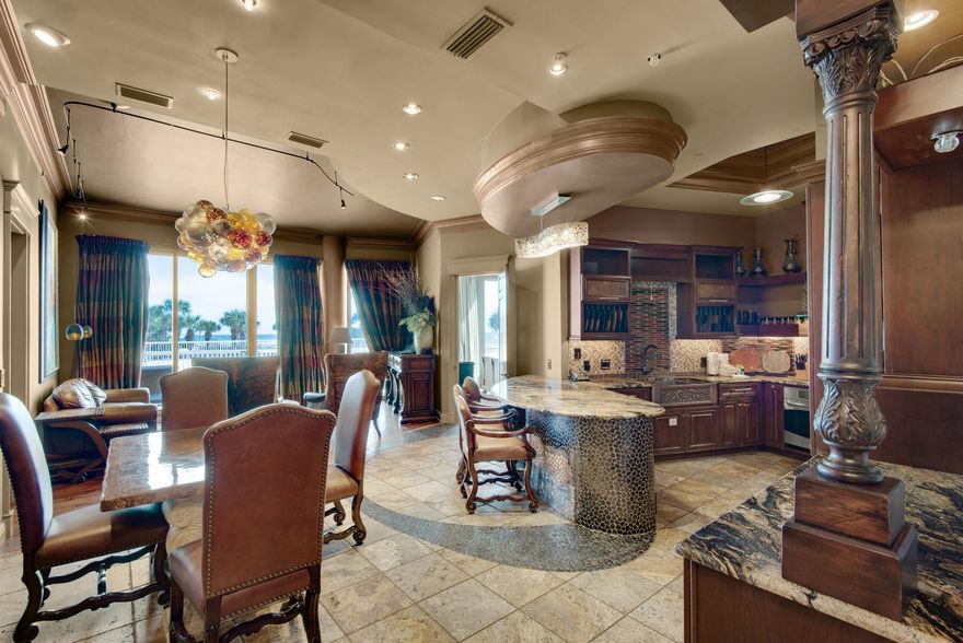 No expense was spared in renovating this elegant condo. High-end finishes and furnishings abound throughout this St. Maarten lanai level condo. 11 ft. ceilings, 8 ft. solid cherry doors, travertine with intricate inlaid tilework and hardwood flooring throughout, gorgeous stone in kitchen and baths, designer furnishings, one of a kind light fixtures and beautiful artwork are just a few of the many upgrades. Enjoy lovely beautiful views from the spacious lanai terrace. This 2 bedroom 2 1/2 bath condo is short term rental capable or also perfect as a second home or primary residence. St. Maarten is located within the Silver Shells Resort in the heart of Destin. The condo is sold with a single car garage & climate controlled storage space. All utilities, even electricity, are included in the