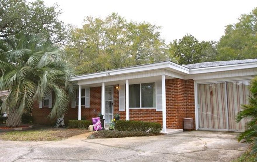 COPPER WIRING THROUGHOUT this charming Mary Esther home, perfectly situated along Miracle Strip Pkwy. near A+ rated schools and Hurlburt Air Force Base, only a short drive from shopping, dining, entertainment and the beautiful beaches along the Emerald Coast, features a beautiful lot with mature landscaping that provides a touch of privacy. Once inside you instantly feel welcome in the spacious living area which leads to the kitchen and dining area. The kitchen provides newer Whirlpool appliances and fresh paint. The naturally lighted sun room is just off the dinning area and leads you to the custom built deck with a trellis pergola. The spacious laundry and storage room lead into additional living space that can be used for a number of things from office space to a home gym.
