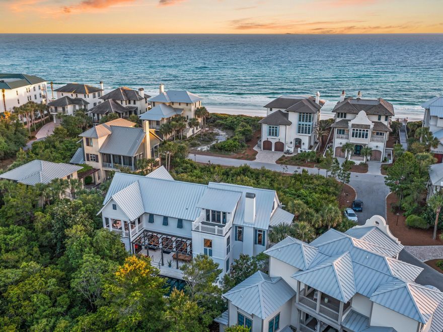 Sitting on more than a quarter-acre of lush greenery, this beach house is just three homes back from one of the community's most pristine and exclusive private beach accesses. Tucked away in a prime coastal enclave, the location offers effortless access to the sugar-white sands and emerald waters that define the 30A lifestyle--just steps from your front door.Recently remodeled with approximately a million dollars in upgrades, this luxurious retreat now features an elevator, a workout room off the owner's suite, and a wealth of modern enhancements including a newer roof, expanded parking, an updated exterior kitchen, an exterior gas fireplace, a remodeled kitchen, a home gym, an HVAC system in the garage, and a newer heater for the pool and spa. The home is partially furnished, and furnishings are negotiable, offering a flexible opportunity to make the space your own while enjoying the curated coastal aesthetic already in place. 

The first floor includes a second sitting room, two ensuite bedrooms, and a brand-new second kitchen designed for independent guests, including separate laundry room. Access to the grand entrance is via a series of steps leading up to one side of the garage. Once inside, you'll immediately appreciate the spacious layout, with treetop views from the sitting area and den offering unparalleled privacy at the beach, and seamless access through French doors onto the covered balcony. The perfect spot to enjoy sunset drinks with fresh gulf breezes and the occasional sound of the waves.

The heart pine floors and antique beamed ceilings create a harmonious connection with the unspoiled natural environment. The newly upgraded kitchen features modern cabinet finishes, a double oven and warming drawer, two dishwashers, and a full range of appliances, including a chip ice maker. It's perfectly suited for entertaining on a grand scale. The quartz-topped island is an ideal hub for serving cocktails and snacks, while ample space ensures that hosting family and friends is always effortless.

The main-floor owner suite boasts a dramatic cathedral ceiling and an adjoining fitness room with triple-aspect windows offering calming views while you work out. The luxurious master bath features an oversized shower with steam shower, his-and-hers marble vanities, and a generous walk-in closet with laundry. A third-floor bedroom balcony showcases breathtaking views of the surrounding 25 acres of conservation land, with sliding barn doors concealing extra storage and a washer/dryer beneath the apex roof. Additional dry attic storage and a whole-home generator provide added convenience.

Step outside to the rear of the property where you'll find a private pool and spa, perfect for morning dips or relaxation beneath the shady pergola. The newly renovated Retreat Beach Club offers a community pool with superb gulf-front views and access to over 3,000 feet of private beach. Sports enthusiasts can enjoy boating, kayaking, and paddleboarding on nearby Draper Lake, or hiking and biking in nearby Point Washington State Forest. Scenic Highway 30A is lined with local restaurants, ideal for alfresco lunches with friends or a cool treat from Blue Mountain Creamery.