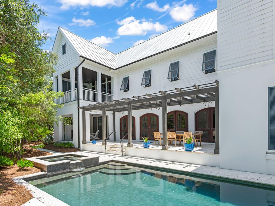Privately tucked away just three homes back from one of the area's most exclusive private beach accesses, this exceptional beach house offers a rare blend of seclusion and convenience to the sugar-white sands and emerald waters of 30A. Set on one of the largest, most lushly landscaped lots in the community--over a quarter-acre and enveloped in mature greenery--this property is a true sanctuary for those who value both privacy and lifestyle. Designed with privacy and flexibility in mind, the home offers multiple living spaces that allow everyone to enjoy quiet moments or gather comfortably. The layout includes a first-floor guest wing with its own sitting area, a fully equipped second kitchen with private laundry, and an upper-level owner's suite complete with a dedicated fitness room and private balcony. Every level of the home offers opportunities to retreat, relax, or entertaincreating an ideal environment for both intimate living and hosting.

Nearly a million dollars in recent renovations have transformed this residence into a luxurious coastal haven. Enhancements include an elevator, fitness room off the owner's suite, new roof, expanded parking, updated exterior kitchen with gas fireplace, remodeled chef's kitchen, pool and spa with newer heater, and a climate-controlled garage with HVAC.

The flexible floor plan offers elevated livability across multiple levels. The first floor features a second sitting room, two ensuite bedrooms, and a fully equipped second kitchen with its own laundryideal for independent guests or multigenerational living. The main living level is anchored by an open-concept living and dining space with soaring treetop views, heart pine floors, and antique beamed ceilings. French doors lead to a covered balconyperfect for sunset cocktails cooled by Gulf breezes.

The gourmet kitchen is designed for entertaining, with custom cabinetry, double ovens, warming drawer, two dishwashers, quartz island, and a full suite of appliances including a chip ice makerperfect for gatherings large or small.

The owner's suite offers a true retreat with a dramatic cathedral ceiling, adjoining fitness room with panoramic views, and a spa-like bath complete with oversized steam shower, dual marble vanities, and walk-in closet with built-in laundry. Upstairs, a third-floor bedroom offers sweeping views over 25 acres of conservation land, with smart storage and its own private balcony for peaceful relaxation.

Outdoors, the property continues to embrace a private lifestyle. A beautifully enclosed courtyard, positioned along the right side of the home, serves as a tranquil outdoor living spaceperfect for morning coffee, quiet reading, or entertaining apart from the main entry and pool areas. In the rear, a secluded pool and spa area is surrounded by lush landscaping and a shaded pergola, offering complete privacy for both daytime swims and relaxed evenings. The newly renovated Retreat Beach Club adds further amenities, including a Gulf-front community pool and 3,000 feet of private beach access.

For those drawn to an active lifestyle, Draper Lake offers kayaking and paddleboarding, while Point Washington State Forest invites you to explore miles of scenic trails. And when it's time to dine or shop, Scenic Highway 30A's celebrated restaurants and boutiques are just moments away.

Partially furnished with negotiable offerings, this beautifully updated property offers an unparalleled combination of privacy, luxury, and lifestyleall within the coveted enclave of the Retreat.