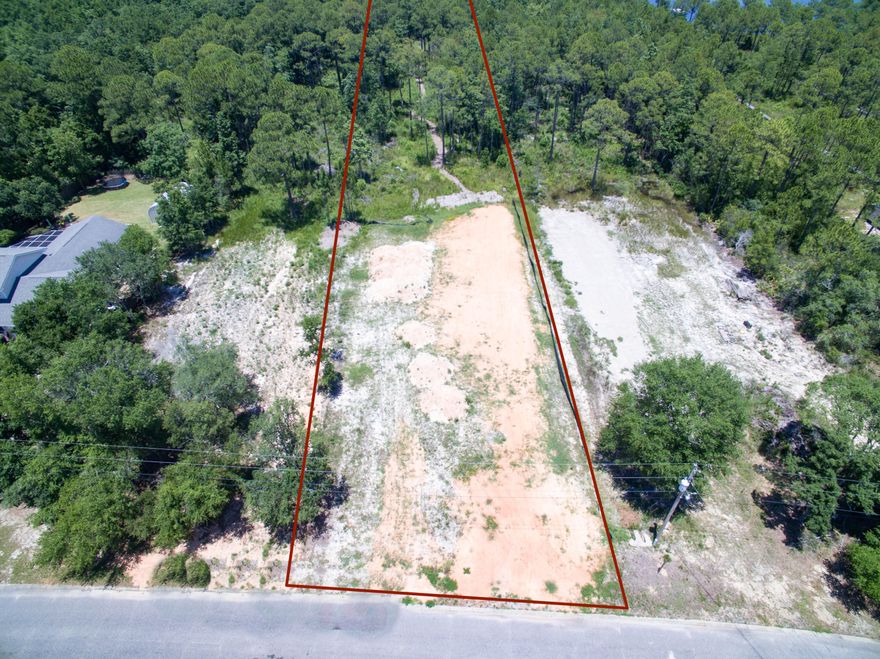 Partially cleared with a path to the bay, this approx. 2.29 acre lot is waiting for your vision and dream home tucked away in an established neighborhood!