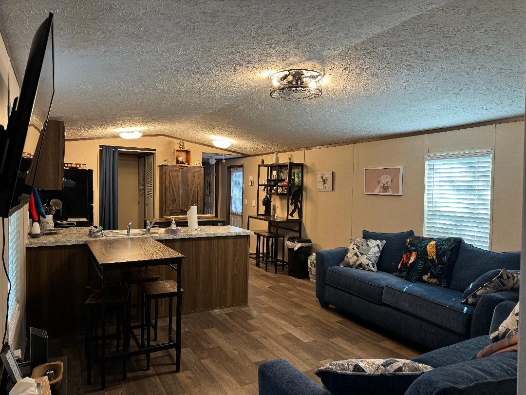 This a FURNISHED 3 bedroom, 2 bath Single Wide has been used on our Airbnb program as well as used as a long term fully furnished rental. It can also be arranged to rent out long term unfurnished.The property also has two 1 bedroom, 1 bath cabins next door that are on the Airbnb program.The owners live on the property as well. The front portion of the property is a working Equestrian Riding Center, and the owners expect all tenants to honor the quiet hours and speed bumps on the driveway. Tenants are not allowed unaccompanied in the stable area.