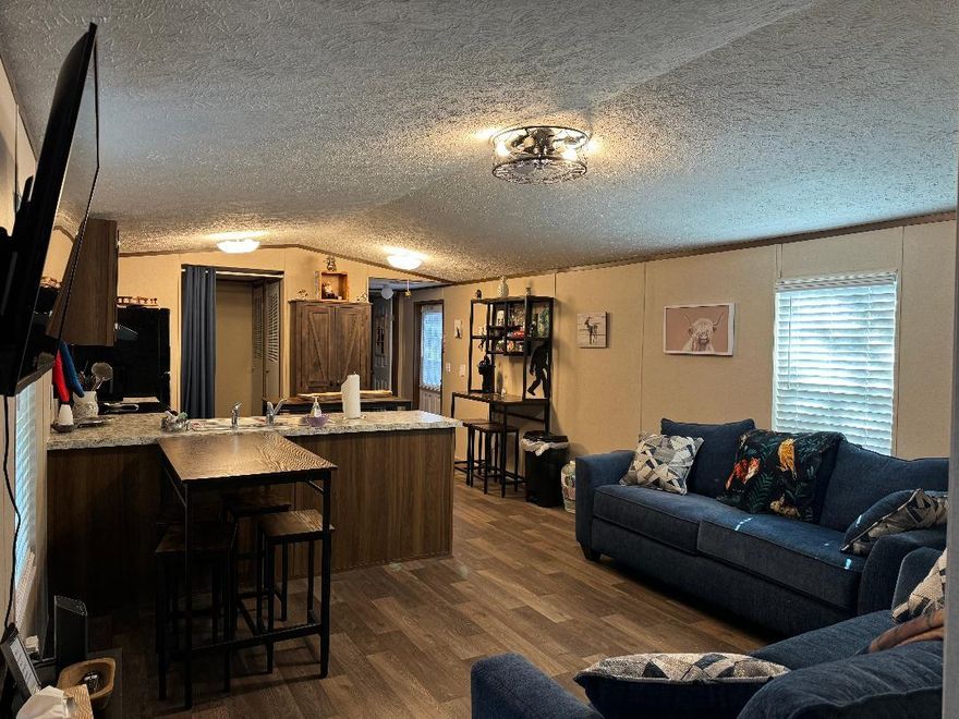 This a FURNISHED 3 bedroom, 2 bath Single Wide has been used on our Airbnb program as well as used as a long term fully furnished rental. It can also be arranged to rent out long term unfurnished.The property also has two 1 bedroom, 1 bath cabins next door that are on the Airbnb program.The owners live on the property as well. The front portion of the property is a working Equestrian Riding Center, and the owners expect all tenants to honor the quiet hours and speed bumps on the driveway. Tenants are not allowed unaccompanied in the stable area.