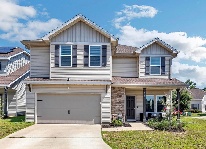 Don't miss out on your opportunity to own this beautiful like new home located conveniently in South Crestview!! This wonderful Springfield plan offers 5 bedrooms and 3 bathrooms! One Bedroom and bathroom is located on the first floor. Up stairs there is a study or bonus area for additional space!!  The beautiful kitchen features a breakfast bar and pantry! This home has beautiful upgrades that the standard newer construction doesn't have, to include custom backsplash, unique lighting and molding. The living room and dining room have a custom arched/column entry. The primary suite features two walk-in closets!! Three additional bedrooms and laundry are located on the second floor. This home has front and back covered porches! Enjoy time in fenced back yard!!