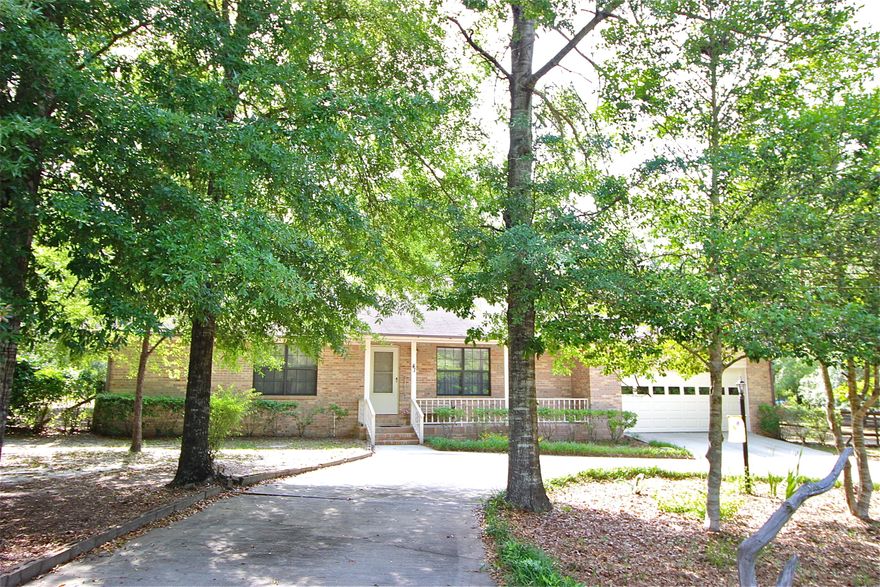 Location, condition and price come together! This exceptionally well cared for all brick home on 1 acre is move-in ready and ready to qualify for any type of financing. There is the equivalent of 2 masters, side by side, each with its own large bathroom and walk-in closet. Very large living room, with room enough for lots of family and furniture! There's a front porch as well as the back sunroom, which has been fully enclosed and is heated and cooled. Attached 2 car garage and circular drive, along with completely fenced back yard, all on just over 1 acre. The parcel across the street is owned by the county and includes a lakefront park - so no one will be building across the street AND you get all the benefits of lakefront living without the lakefront price! Just walk to the lake!