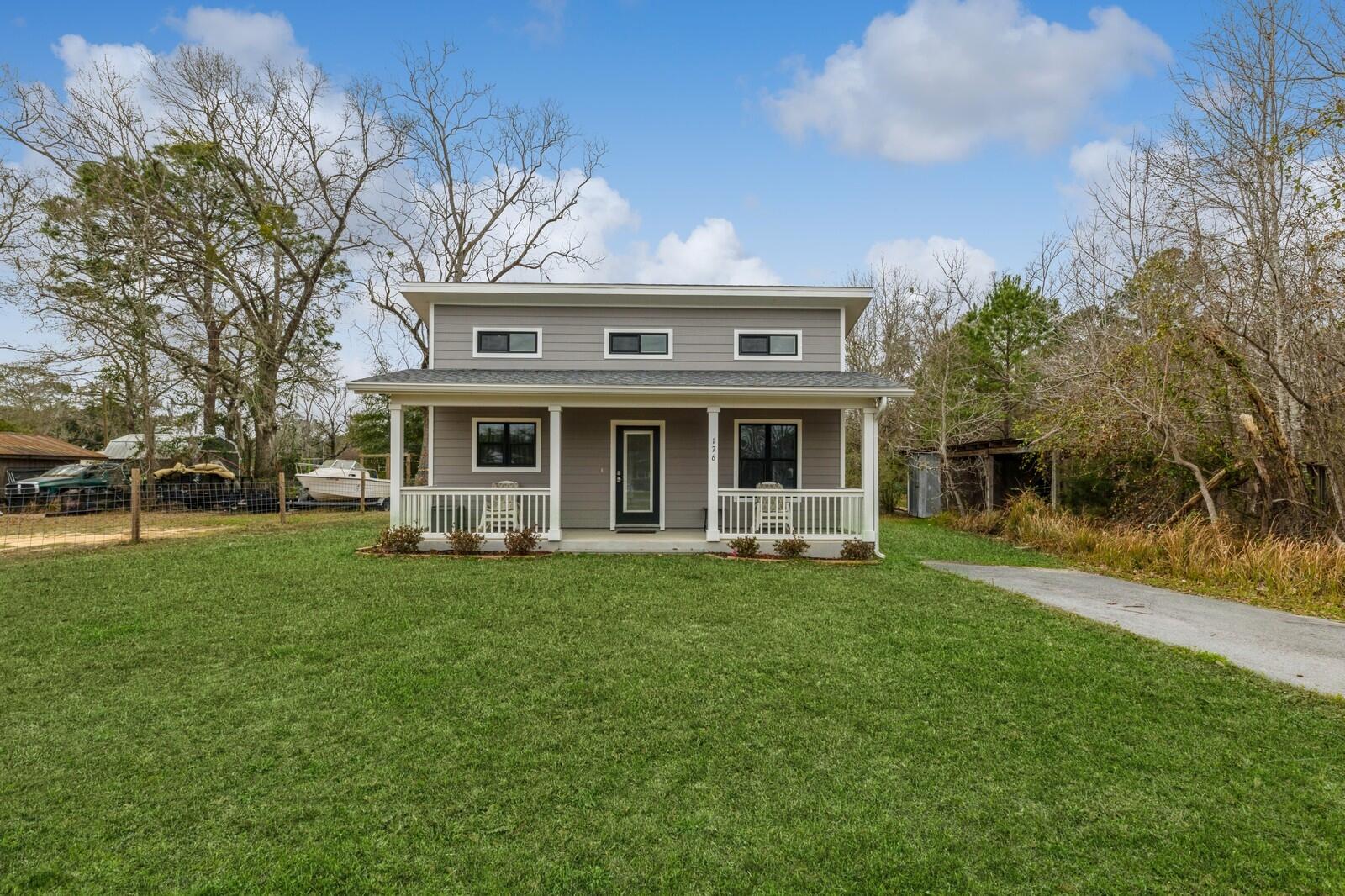 Sellers offering $3,000 ''anyway money'' to buyers at closing! Don't miss out on this rare chance to own a home in the heart of Freeport! This 2-bedroom, 1-bathroom home, custom-built in 2020, offers ample parking and the flexibility of no HOA, allowing you to accommodate your recreational vehicles. As you step onto the large front porch, you'll find plenty of space to kick back and relax. Inside, the open concept kitchen, living, and dining room welcomes you with high ceilings and lots of natural light. The owner spared no expense in creating a dream kitchen featuring soft-close drawers, large cabinets with ample storage, a gas range with griddle, and a spacious stainless steel sink. Bid farewell to carpets; modern vinyl plank flooring spans the entire home, making cleaning a breeze.