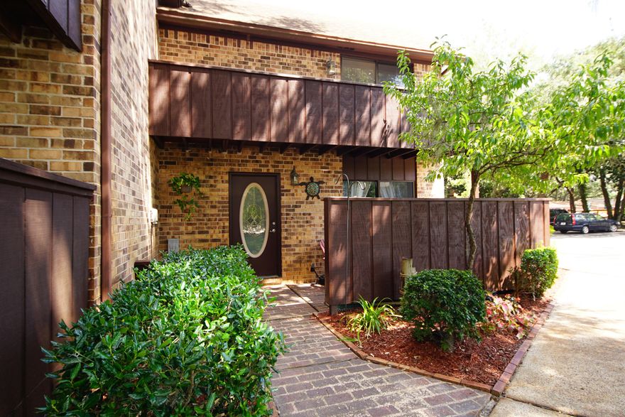 Beautiful Water Views from several rooms!! This lovely townhome has a lot to offer. There are 3 br/2 ba, two living areas and a large kitchen that has recently been updated. Both bathrooms have been updated as well. The tile on first floor has been cleaned and resealed (looks great). The bedrooms are all on 2nd floor. Two of them have views of the water and have access to balcony. The third bedroom has a balcony that overlooks the mature oak trees with moss. The entire area is adorned with the mossy oaks and looks just relaxing and lovely. There is a sun room and a back deck. The association just had the seawall rebuilt last year and the dock was redone in 2016. The pool is large and always ready for you! Two tennis courts are available and they have the Pickle ball markings. Come