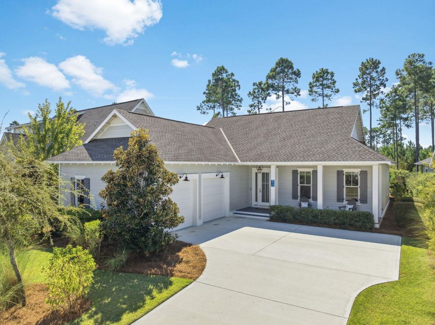Located in the sought-after Pathways phase of Watersound Origins, this custom Huff Homes floor plan offers timeless design and thoughtful details throughout. Featuring 4 bedrooms, 3.5 bathrooms, a welcoming covered front porch, and a side-load two-car garage, this home blends coastal charm with modern luxury.Inside, a wide foyer with shiplap walls and a convenient mudroom with storage cubbies sets the tone, complemented by a rare hall coat closet. The chef's kitchen is a standout with quartz countertops, ceiling-height cabinetry with glass display doors, under-cabinet lighting, and a suite of premium appliances including a Wolf Dual Fuel 30'' range, Sub-Zero refrigerator with bottom freezer drawer, Sharp microwave drawer, Best chimney vent hood, & Asko dishwasher. There is an oversized walk-in pantry with wood shelving in the hallway. The open-concept layout flows seamlessly from the kitchen to the dining and spacious living room, highlighted by additional shiplap walls.
The primary suite, tucked privately at the back of the home, features a focus wall of shiplap, a spa-inspired bath with dual vanities, a soaking tub, walk-in shower, and an oversized double-hung closet with wood shelving and storage cubbies. Three guest bedrooms are situated separately, offering comfort and flexibility.
Outdoor living is equally impressive with a full-width screened porch large enough for dining and lounging, plus a concrete patio with gas stub-out for grilling. The backyard overlooks a serene preserve, offering natural beauty with low-maintenance landscaping (note: not sized for a pool).
Additional upgrades include:
* Medallion wood floors (light) throughout
* Sound-deadening insulation
* Handheld shower fixtures in all baths
* Tankless water heater
* Oversized laundry with cabinets and wood shelving
184 Trailhead Drive is move-in readyan ideal blend of craftsmanship, comfort, and convenience in one of Origins' most desirable phases. 
