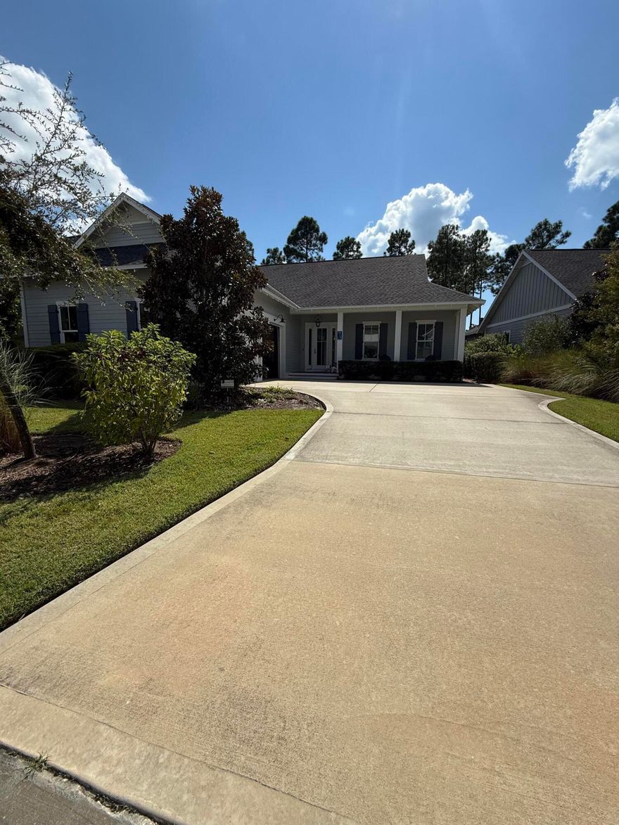*COMING SOON - Professional photos forthcoming* Located in the sought-after Pathways phase of Watersound Origins, this custom Huff Homes floor plan offers timeless design and thoughtful details throughout. Featuring 4 bedrooms, 3.5 bathrooms, a welcoming covered front porch, and a side-load two-car garage, this home blends coastal charm with modern luxury.Inside, a wide foyer with shiplap walls and a convenient mudroom with storage cubbies sets the tone, complemented by a rare hall coat closet. The chef's kitchen is a standout with quartz countertops, ceiling-height cabinetry with glass display doors, under-cabinet lighting, and a suite of premium appliances including a Wolf Dual Fuel 30'' range, Sub-Zero refrigerator with bottom freezer drawer, Sharp microwave drawer, Best chimney vent hood, & Asko dishwasher. There is an oversized walk-in pantry with wood shelving in the hallway. The open-concept layout flows seamlessly from the kitchen to the dining and spacious living room, highlighted by additional shiplap walls.
The primary suite, tucked privately at the back of the home, features a focus wall of shiplap, a spa-inspired bath with dual vanities, a soaking tub, walk-in shower, and an oversized double-hung closet with wood shelving and storage cubbies. Three guest bedrooms are situated separately, offering comfort and flexibility.
Outdoor living is equally impressive with a full-width screened porch large enough for dining and lounging, plus a concrete patio with gas stub-out for grilling. The backyard overlooks a serene preserve, offering natural beauty with low-maintenance landscaping (note: not sized for a pool).
Additional upgrades include:
* Medallion wood floors (light) throughout
* Sound-deadening insulation
* Handheld shower fixtures in all baths
* Tankless water heater
* Oversized laundry with cabinets and wood shelving
184 Trailhead Drive is move-in readyan ideal blend of craftsmanship, comfort, and convenience in one of Origins' most desirable phases. 
