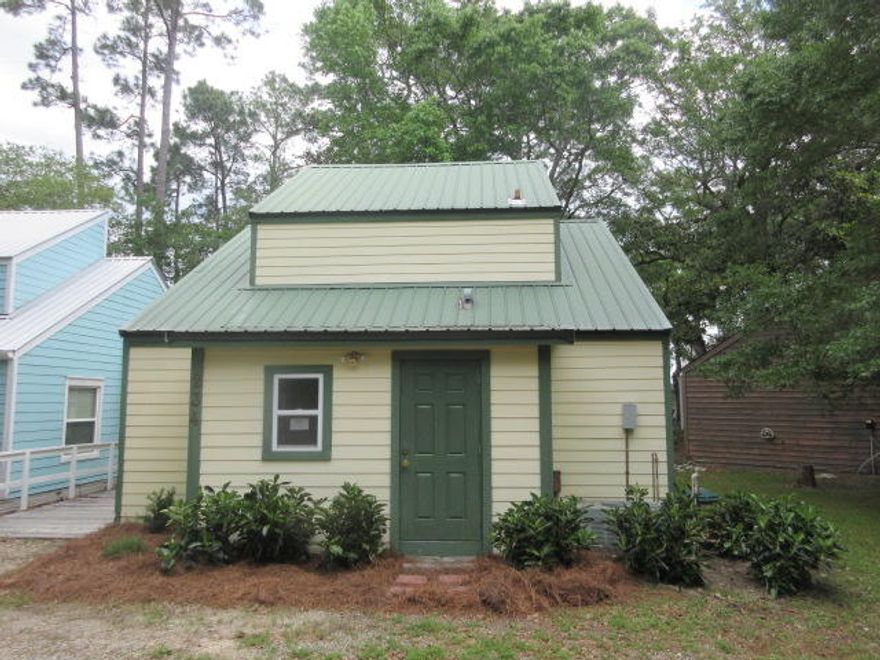 What a cute 2 bedroom, 1 bath REO cottage tucked away on the Bay in Huck n Toms! Wow! 1/4 ownership in the dock! Great location for a year round residence, rental or a vacation get away! The home features vaulted ceilings, tile and carpeted floors, a spiral staircase that leads up to the 2nd loft style bedroom, plenty of storage for all your beach and Bay toys and a huge screened porch that looks out towards the bay perfect for entertaining family and friends. This is a Fannie Mae Homepath Property.