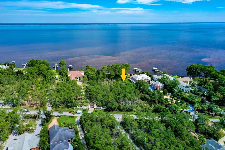 Build your dream home on this Bayfront estate sized lot in exclusive Whispering Oaks.  Surrounded by an impressive array of contemporary bayfront homes and featuring over 100ft of bay frontage.  Within minutes to great shopping, dining and the wonderful emerald waters and white sand beaches of the Gulf of Mexico and last but not least a non-HOA community.  This lot has not been assigned an address by the Walton County GIS department but is estimated to be 384 Walton Way based on surrounding properties.