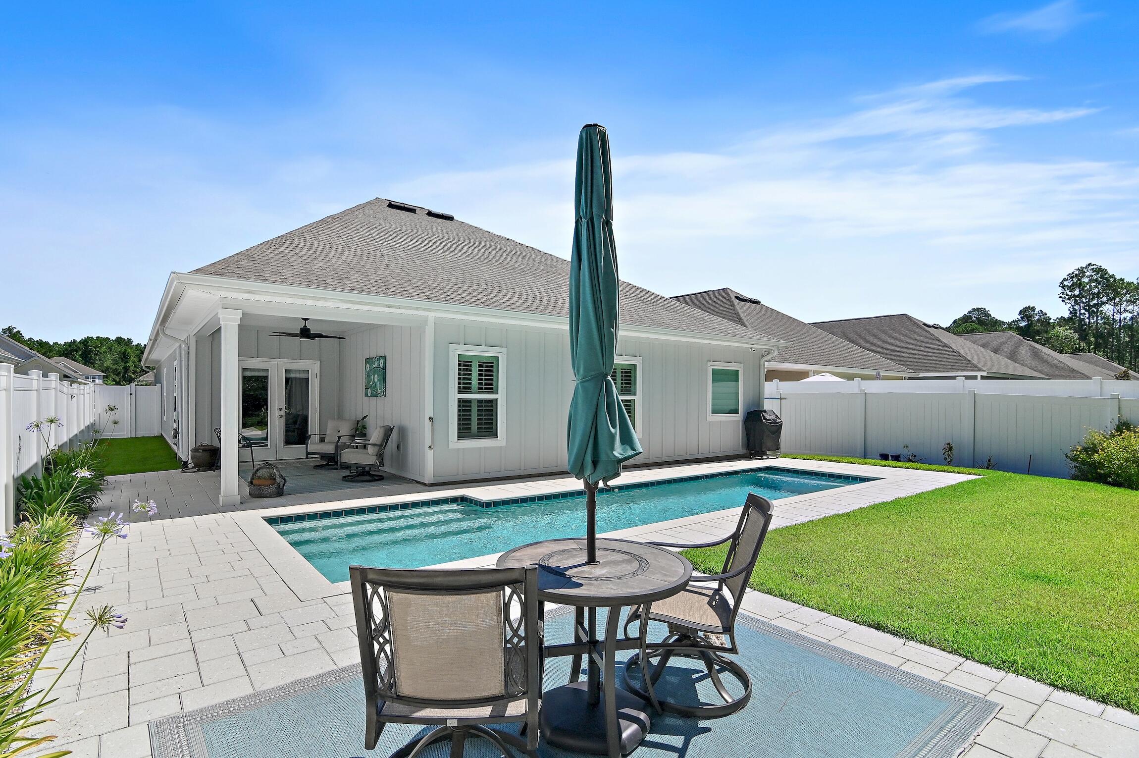 There is a perfect home! This centrally located single level multi-use/generational home + pool is perfect to enjoy life on the Emerald Coast. The home includes an attached 1 bd /1 bath guest suite. The main home features-open floor plan, updated flooring, plantation shutters + more upgrades. Guest suite with separate entrance has many options to meet your immediate & future lifestyle with kitchen, laundry too! The fenced backyard is a private oasis bordered by state owned forest preserve. Enjoy the sunny pool or relax in the shade of the covered patio. Enjoy beaches, golfing, tennis, pickleball, shopping, dining, state parks & nature trails; all within 5 miles. 1.9 mi to hospital, .7 to Walmart, 2.2 mi Grand Blvd, 3.5 mi Sandestin(r) Resort, 1.6 mi Topsail State Park, 3.3 mi public beach