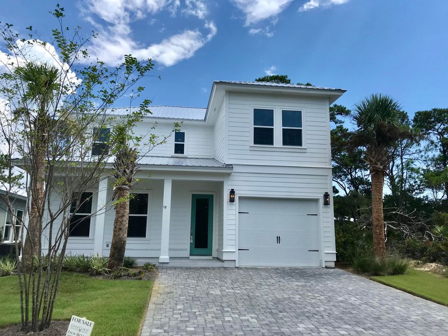 This gorgeous beach villas has white shaker cabinetry, hardwoods floors, and granite countertops. The modern open floor plan features a island bar perfect for entertaining and a master on the main. The Villas of Frangista features many brand new beach homes at affordable prices within walking distance of the beach. Towering palms, cobblestone streets, and a community pool makes this neighborhood quite charming. This home come with beach access, a builders warranty, and is in low risk flood zone X.