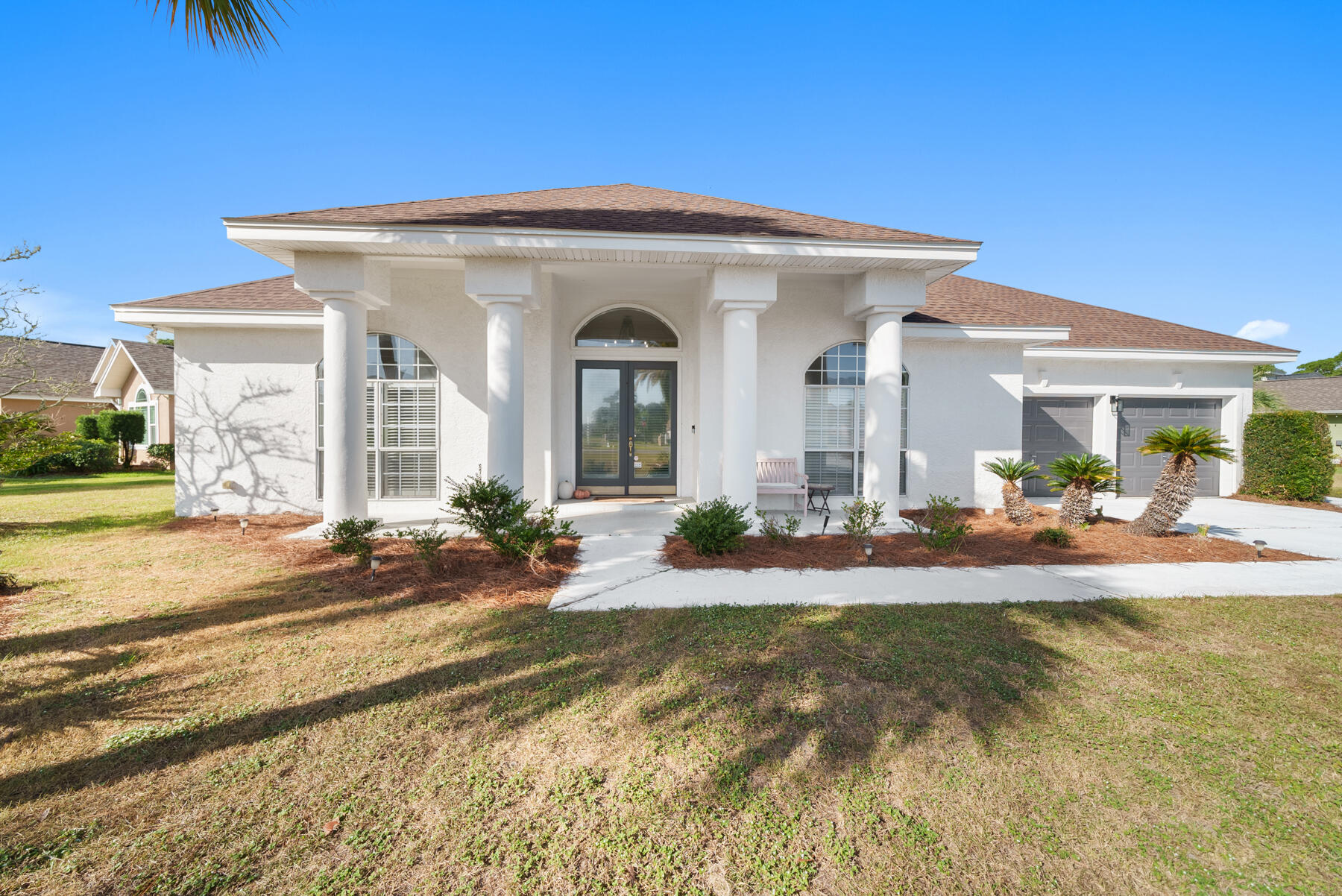 Welcome to this beautiful home in The Glades, a centrally located neighborhood with easy access to local shops, restaurant, beach access and entertainment. Right at the entrance of the neighborhood you will find the newly opened Duplin Winery Step into the heart of the home--the chef's kitchen--where custom wood cabinetry, an oversized island, and granite countertops create a perfect space for culinary enthusiasts and entertainers alike. Open to the great room, this kitchen is truly the home's centerpiece. The great room boasts raised ceilings, built-in cabinets with integrated lighting, and surround sound, providing a wonderful ambiance for gatherings and relaxation. Just off the entryway, you'll find a versatile room that can be used as a formal dining area or an office to suit your lifestyle needs. Retreat to the spacious primary suite, measuring an impressive 24x14, offering ample room for a cozy sitting area or reading nook. The additional bedrooms are generously sized, larger than what you typically find in homes today. Outside, enjoy the private screened pool, with a covered porch with a seating area that's perfect for year-round entertaining or a quiet retreat. With a recently installed HVAC system, this home ensures comfort and efficiency. Don't miss out on the opportunity to make this beautifully designed home in The Glades your own!