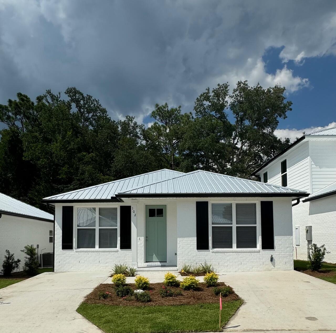 Brand new construction - Florida Cottage. This 2 bedroom, 2 bath, home is located in a quaint new neighborhood - The Cottages - in Valparaiso consisting of 20 new homes. Painted brick, quartz counter tops, stainless steel appliances, LVP & tile flooring, metal roof, and much more. Home will have parking for two vehicles, plus there is additional guest parking in the neighborhood. Other plans are available. Buyers to verify all deemed important information.