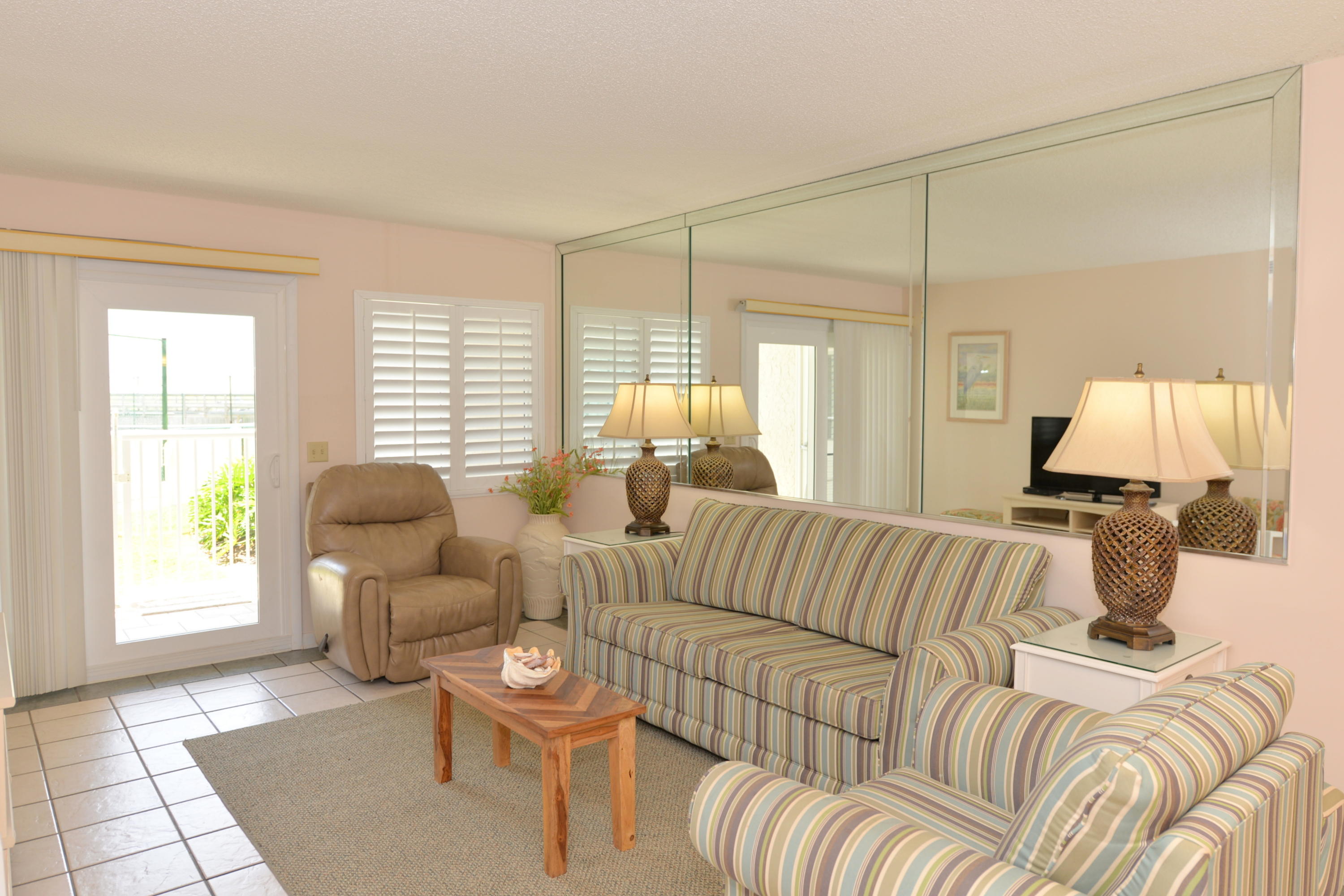 HIGHLY DESIRABLE FIRST FLOOR TWO BEDROOM UNIT AT HOLIDAY SURF & RACQUET CLUB! No steps, no elevators easy living! Park in front of your front door & walk directly into your condo. From the living room or master bedroom, walk directly out to the pool & on to the beach. Holiday Surf & Racquet Club has undergone major exterior improvements new paint & new tile patios as well as boardwalk restoration plus the lobby has been transformed into a well-decorated & comfortable place to arrive & or to meet friends. Holiday Surf & Racquet Club has tennis courts, shuffle board, his & hers exercise rooms, lush landscaping throughout the complex, & a game room. This complex also offers sauna baths, a large conference room with fully-equipped lounge with kitchen facilities. Holiday Surf & Racquet