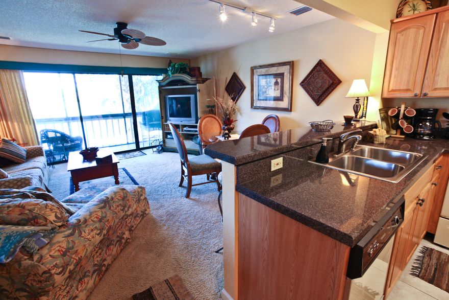 Rare opportunity for a townhouse condo in the coveted Lakefront area of Seascape. Completely remodeled 2BR+/2BA unit on the Lakefront, just steps away from the beach access, one of five community pools, and with a terrific freshwater fishing lake right behind the unit. Screened decks on the main level and off the MBR offer fabulous lake and golf course views. The entire second level is the over 500 sf master suite, with vaulted ceiling, private deck, and master bath featuring a 5' jacuzzi tub, separate shower and lavatory, and 12 feet of full length closets. The main level features a beautifully decorated living room, dining area, kitchen with breakfast bar, and a second bedroom with attached full bath. Enjoy the Tommy Bahama experience in this well-cared-for beach home. Sold furnished.