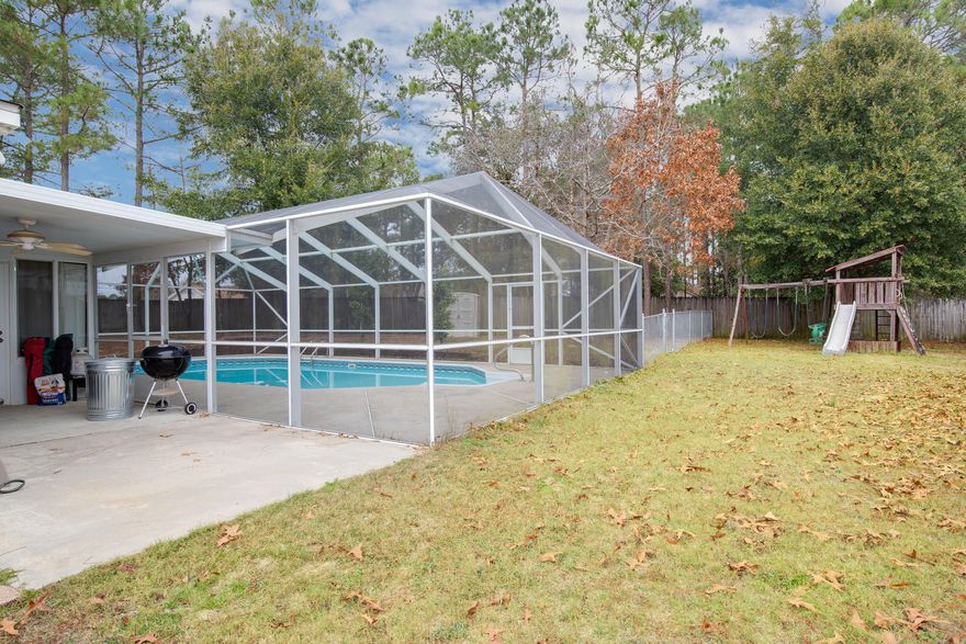 There is No Better Gift than a HOME for the Holidays! Rare to Find Screen Enclosed POOL Home on Large 0.34 acre Lot, in sought after Southwest Crestview below I10! UPGRADES Abound in this Split 3 Bedroom & 2 Bath Home with Separate Office that could easily be converted into a 4th Bedroom. This home has a Spectacular & Spacious Remodeled Kitchen that features high end stainless steel appliances, granite countertops, wood cabinets, island with room for seating, & separate walk-in pantry. Ideal open floor plan with well thought flow & well sized living spaces. The living area features a wood burning fireplace and wall-mount for your TV. Master bedroom has added privacy from the other bedrooms. The Remodeled Master Bathroom with Garden Tub, Separate Shower, Dual Vanities, & 2 Walk-in Closet. The other 2 Bedrooms are located on the opposite side of the home with a designated Full Bathroom with Tub / Shower. Home also features an indoor separate Laundry Room. From the glass door in the living room you step out to an enclosed Heated & Cooled Sun Room perfect for anything you can imagine... entertainment area, gym, hobby space, or a retreat for your favorite pet. The Backyard is a dream with a fully screen enclosed Large 37' x 17' Salt-Water Pool! Backyard has additional chain-link fence that divides the yard space for the perfect pet play zone, while separating area for the owners to enjoy. The yard is also pretty flat & level, so you have full utilization of the yard space. A Exterior yard building is perfect for storing your yard equipment. The perimeter of the back yard is fully privacy fenced. Additional Upgrades in the home include HVAC which was replaced in 2010 and includes UV light allergen filtration. Heat/AC unit was installed in sun room in approx. 2016. The screened in pool was added in 2010. Master Bathroom was remodeled in 2015. Kitchen also remodeled. This house is on public sewer which is a rare find in Countryview estates! Convenient to all bases, shopping, dining, and beaches. Zoned for top rated schools in the area. Don't wait to see this wonderful home, call your Realtor TODAY!!!