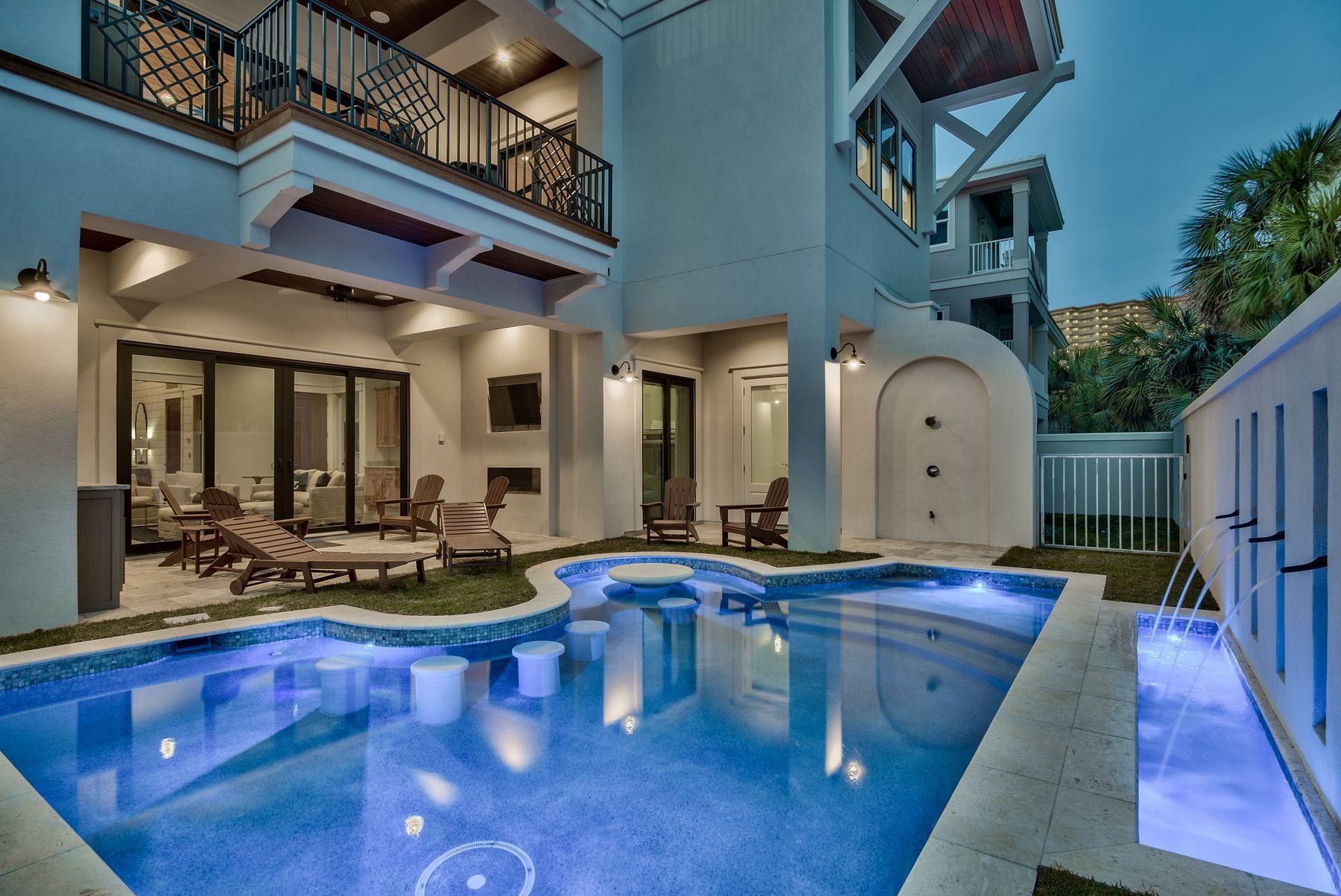 Discover this newly constructed coastal architectural marvel perfectly situated to capture gulf views & masterfully configured providing unparalleled amenities including a Watermark-built private resort style pool area complete with a covered outdoor summer kitchen and adjoining spa. This is the ultimate beach house, an excellent income producer with outstanding opportunity to yield short term rental income. This home was designed to maximize functionality and finely appointed with chic coastal finishes while affording optimal comfort & living space.