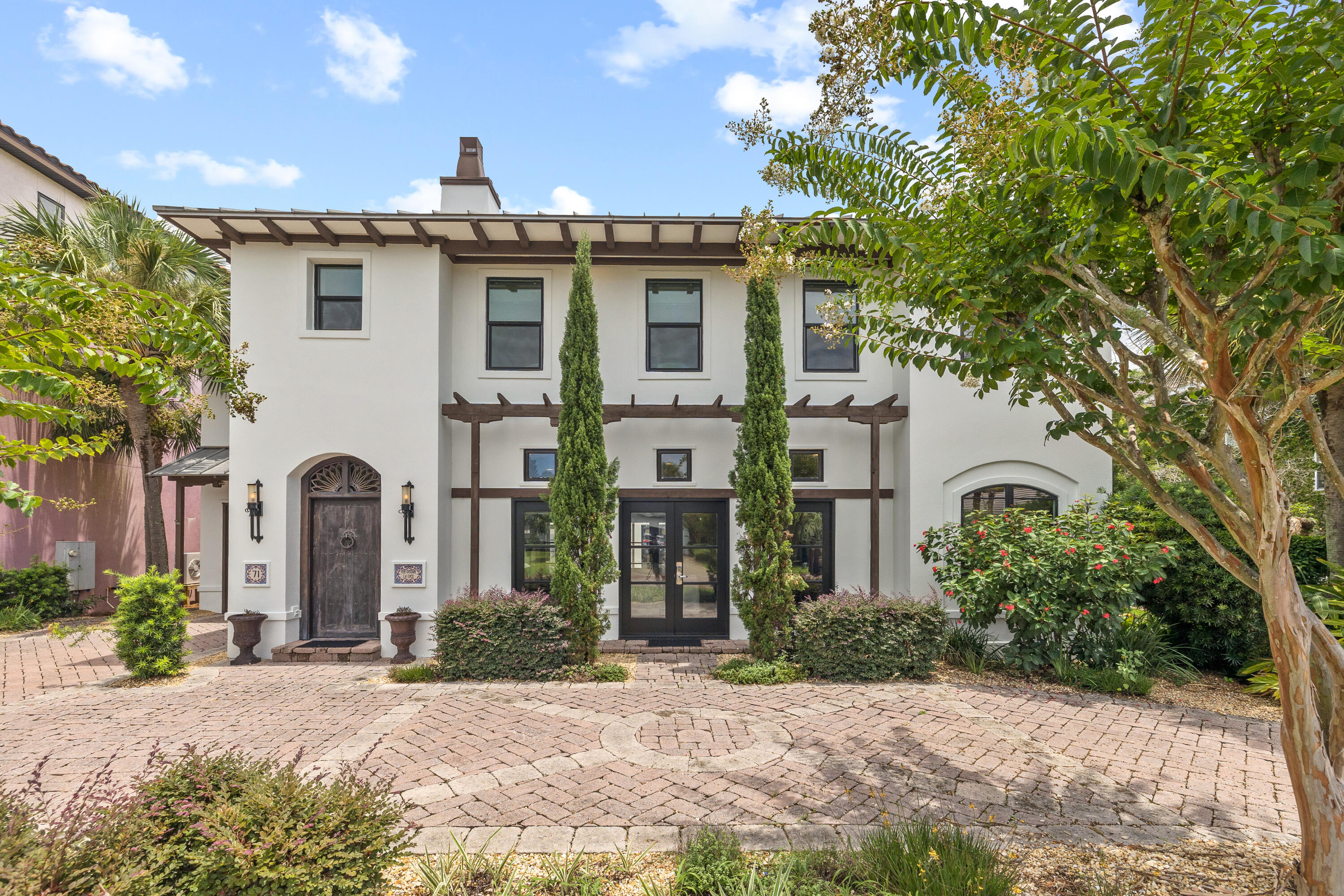 Behind the gates of the sought-after community of Destiny East sits this exceptional five bedroom Tuscan-inspired villa. The Italian-styled architecture makes it one of the most unique homes in the neighborhood and is recently updated with fresh interior and exterior paint. Designed with entertaining in mind, the open concept showcases a spacious living area that leads to the stunning outdoor courtyard, complete with a heated pool and covered patio, blurring the lines of indoors and out. The master chef's kitchen, designed by Atlanta-based Frank Neely Design Associates, features a brick backsplash, concrete countertops, freestanding island, separate wine cooler and ice maker, and Subzero and Thermador appliances. The dining room is flooded with natural light and features a wall of windows overlooking the outdoor courtyard. The first level is completed by the laundry room, powder room, and newly finished office space connected to the garage.

The primary suite and ensuite guest bedroom are on the second level and both offer access to the private terrace overlooking the outdoor pool and patio below. The oversized primary suite features a vaulted ceiling, sitting room, soaking tub, coffee bar, and an additional space that could serve as an office or additional dressing area/closet. Across the courtyard from the main house sits the guest house, complete with two bedrooms, full bathroom, a kitchenette, and a spacious sitting area.

This exceptional turnkey home makes it the ideal primary residence, vacation home, or investment opportunity. 71 Tranquility Lane is perfectly positioned minutes from sugar sand beaches and turquoise waters, world-class restaurants, shopping, entertainment, and champion golf courses. Destiny East has numerous neighborhood amenities that includes a clubhouse, multiple pools, tennis courts, a movie theatre, outdoor grills, a fully equipped gym, and a new playground. Inquire today to schedule a private showing and start living the coastal lifestyle you deserve!