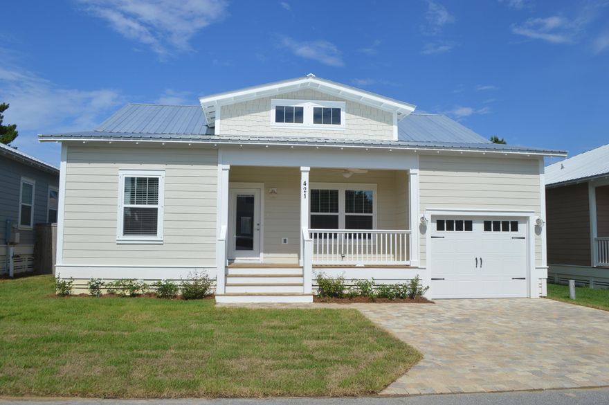 NEW CONSTRUCION WEST END PCB! Paradise Grove is one of PCB's hottest new subdivisions. Close to Pier Park and a short drive to 30A. This gated subdivision features a resort style pool, lush landscaping and community park areas. This home is a 3 bedroom/ 2 bath with a multi-functional bonus room. Can be a bedroom, bunkroom, office or dining room. Many upgrades such as the ''coastal'' trim package, brushed nickel hardware, hardi-like exterior, wood look tile in the main areas, granite countertops, stainless appliances and more. The Master Bedroom has a large walk in closet. The Master bath has double vanities, soaking tub and separate shower with a glass door.