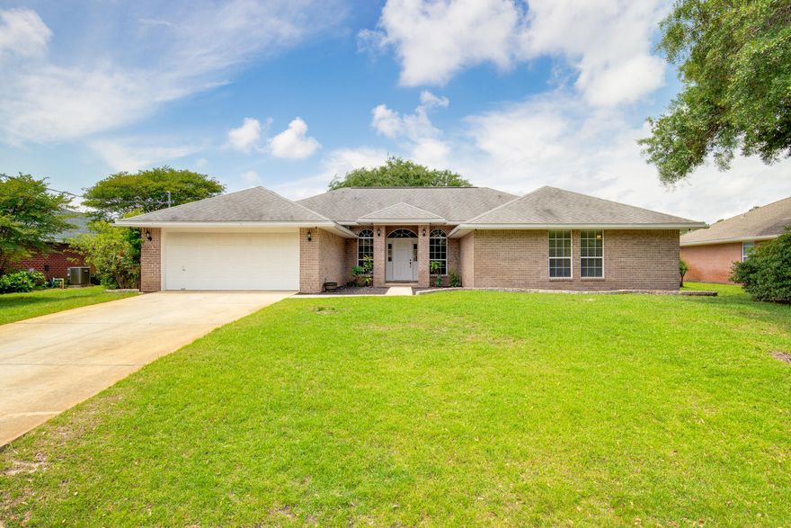 LOOKING FOR SPACE? YOU'VE FOUND IT.
Fantastic Home with several large Living areas in a great neighborhood! Offering a GIANT 513 SF Great rm PLUS 2 add'l 168 SF living areas ideal for a media rm, office, formal Dining or play rm, there's plenty of space to accommodate a busy lifestyle. Taking center stage, you'll love the huge Kitchen w/ island, eating bar, newer SS appliances & large pantry. His & her sinks, garden tub & walk-in shower accent the Master bath which adjoins the spacious Master BR. Offering beautiful new laminate flooring in Foyer, two Living areas & ALL Bedrooms plus tile everywhere else, there's no carpet. A 250 SF covered Patio & spacious fenced backyard provide a peaceful setting to enjoy the Fl lifestyle & plenty of room for a pool. Other features include an extra large laundry room, 5 yr old AC, 1 yr old SS dishwasher, 3 yr old SS refrigerator, stove & microwave, walk-in pantry, all new doors & hardware, large closets, new brushed bronze fixtures, new fluorescent lighting in garage, rubber mulch, irrigation system w/new lawn pump, all new night & motion sensing exterior lighting front and back, gutters & rain chains, stone landscaping & large fig tree that produces figs twice a year!  A 2005 roof provides newer wind mitigation credits.  Home warranty, leather living room set, 10 ft Farm table & chairs patio set and yard tools are conveying with full price offer. Located in Quayside Village in the Tiger point area, this wonderful Home is close to schools, shopping, restaurants & the beach.