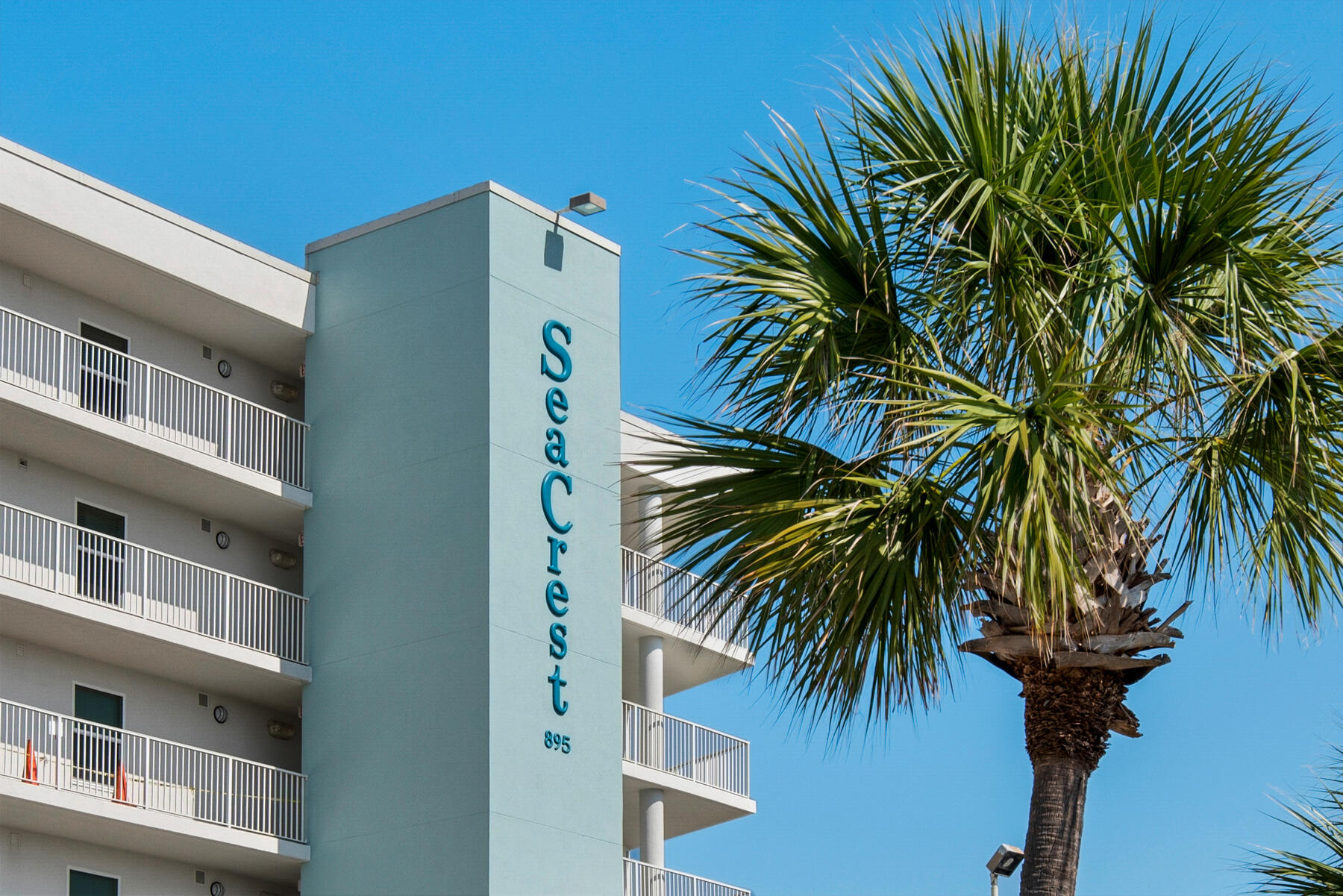 Lowest priced 3/3 on the Island!! Beautifully updated 3 Bed 3 Bath with lockout unit! Projections of $58,000+. Can be rented as a 2/2 and 1/1 or as a 3/3. The 1/1 lockout has its own private balcony, coded front entrance, washer + dryer and kitchenette! West facing unit with beautiful sunsets! Second floor so no worries about flooding. This is a large unit at 1,300 square feet. Seacrest is a gulf front complex covering 1.9 acres total. It has an indoor and outdoor heated pool and on an onsite gym. The beach entrance is only steps away! Seacrest just had brand new hurricane-resistant doors & windows installed, the entire exterior painted and the pool was refinished. All paid for already. Deeded garage parking spot 215 will transfer to new owner with the purchase as well.