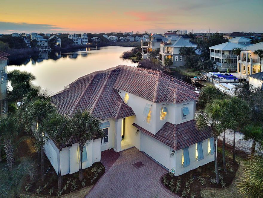 This casual coastal contemporary home seamlessly blends serenity and elegance into this beach-side lake front residence. It's perfectly situated two tiers off the Gulf of Mexico in the gated community of Destiny. In 2018, this home received a complete transformation by Coastline Luxury Homes with professional interior design & tastefully appointed furnishings. This home features 5 bedrooms, plus a bunk room, 4 full bathrooms and a large open floor plan with clean lines and pristine lake vistas. This lake front retreat is ideal for large families or an exemplary investment opportunity with over $200,000 in projected gross annual rental income for 2019.....