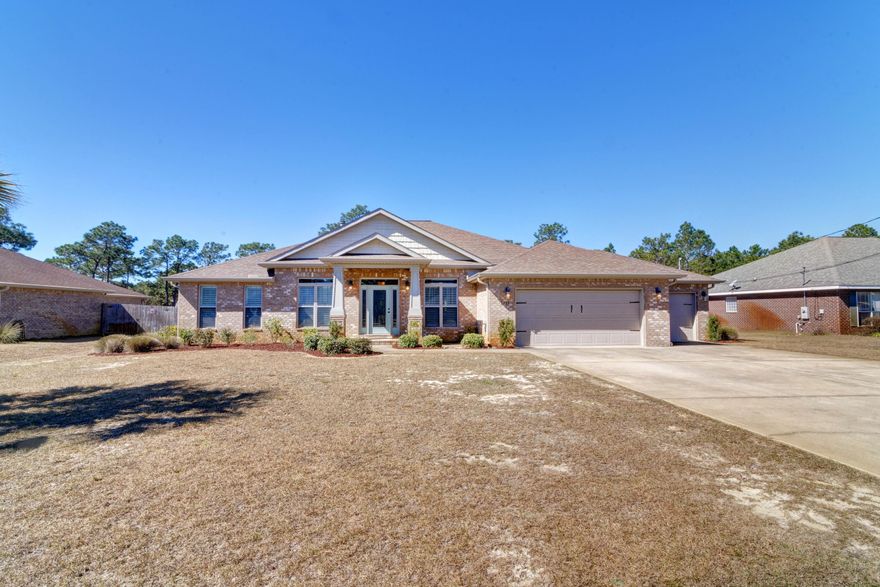 Prepare to fall in love! Welcome to this gorgeous custom Gooden home in Holley by the Sea located on an oversized 0.76 acre lot on a quiet dead end street. Featuring 4 bedrooms, 3 baths, a formal dining room, separate office, AND a bonus enclosed interior sunroom/bonus room - this home truly has all the space you're looking for in just over 3000sqft. Better than new, previous updates include gorgeous custom high end granite counters in the kitchen, a deep well copper sink, gourmet french door refrigerator, double wall ovens, pull out drawers in the lower cabinets, and a breakfast bar with shiplap. Real Acacia hardwood floors extend throughout the common areas with porcelain tile in the wet areas. Custom plantation shutters are found in every room, as well as custom sun shades on the back