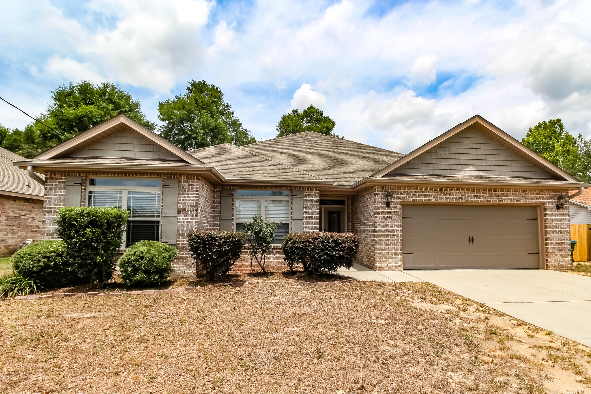 Award winning ''Parade of Homes'' winner Watree Homes didn't overlook any detail while building this custom 4/2 home that offers over 2300 sq ft. Upon entry your welcomed by an ornate full glass front door with matching side light, and a grand foyer. Porcelain tile, 5 -1/4 baseboards, and solid core arch topped doors throughout are just a few of the details you'll find when you walk in. The 9ft ceilings throughout give it an open and bright feel. In the kitchen you are surrounded by high end stainless appliances, granite countertops, huge pantry, custom backsplash, and fine wood cabinetry with soft close doors and drawers. The large master bedroom features trayed ceilings with crown molding that rises up 10 feet! The master bath boasts an elegant cultured marble double vanity, garden tub and