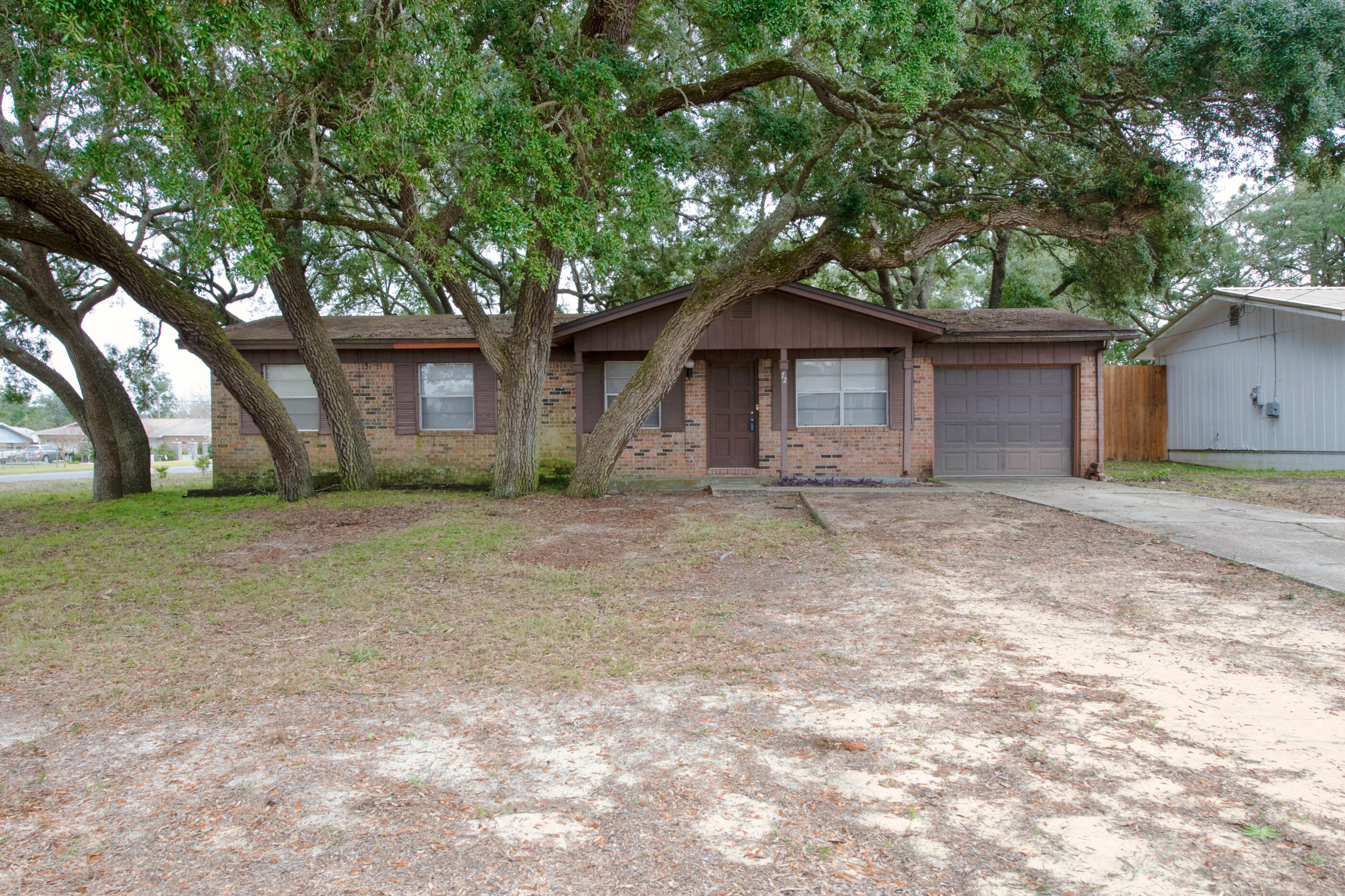 OPEN HOUSE Sat, 1/8 from 11am-2pm. Four Bedroom, 2 bathroom home on corner lot with mature trees, outdoor brick fireplace, and an opportunity to make it your own. Eat in kitchen/dining area, living room, several closets for storage and attached garage with laundry area and above garage attic storage. Master bedroom has en suite bathroom. 3 additional bedrooms share another full bathroom w/tub. All information deemed important to be verified by buyer.